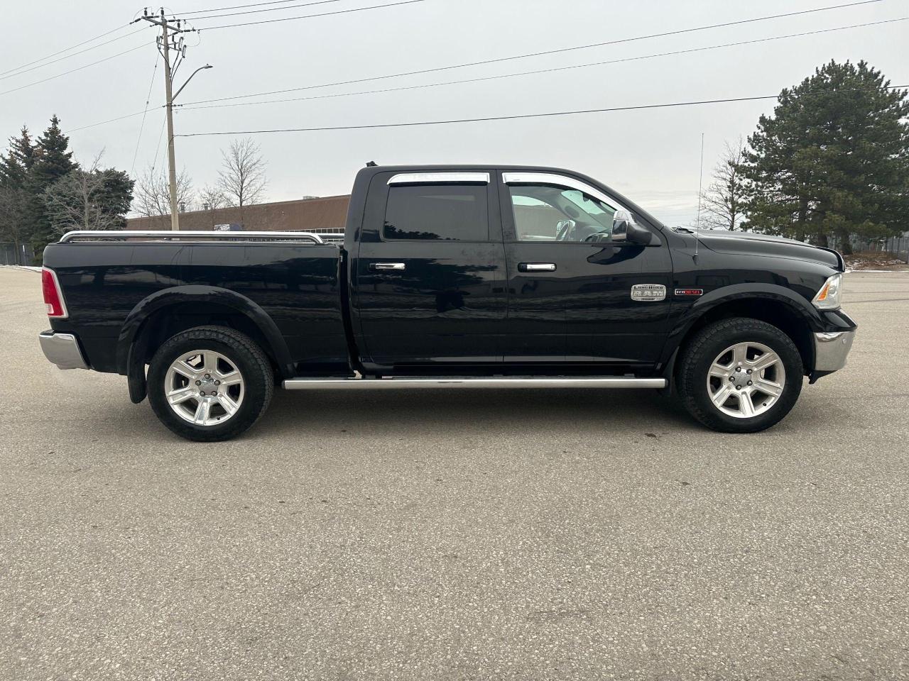 2014 RAM 1500 4WD Crew Cab 149" LARAMIE LONGHORN - Photo #7