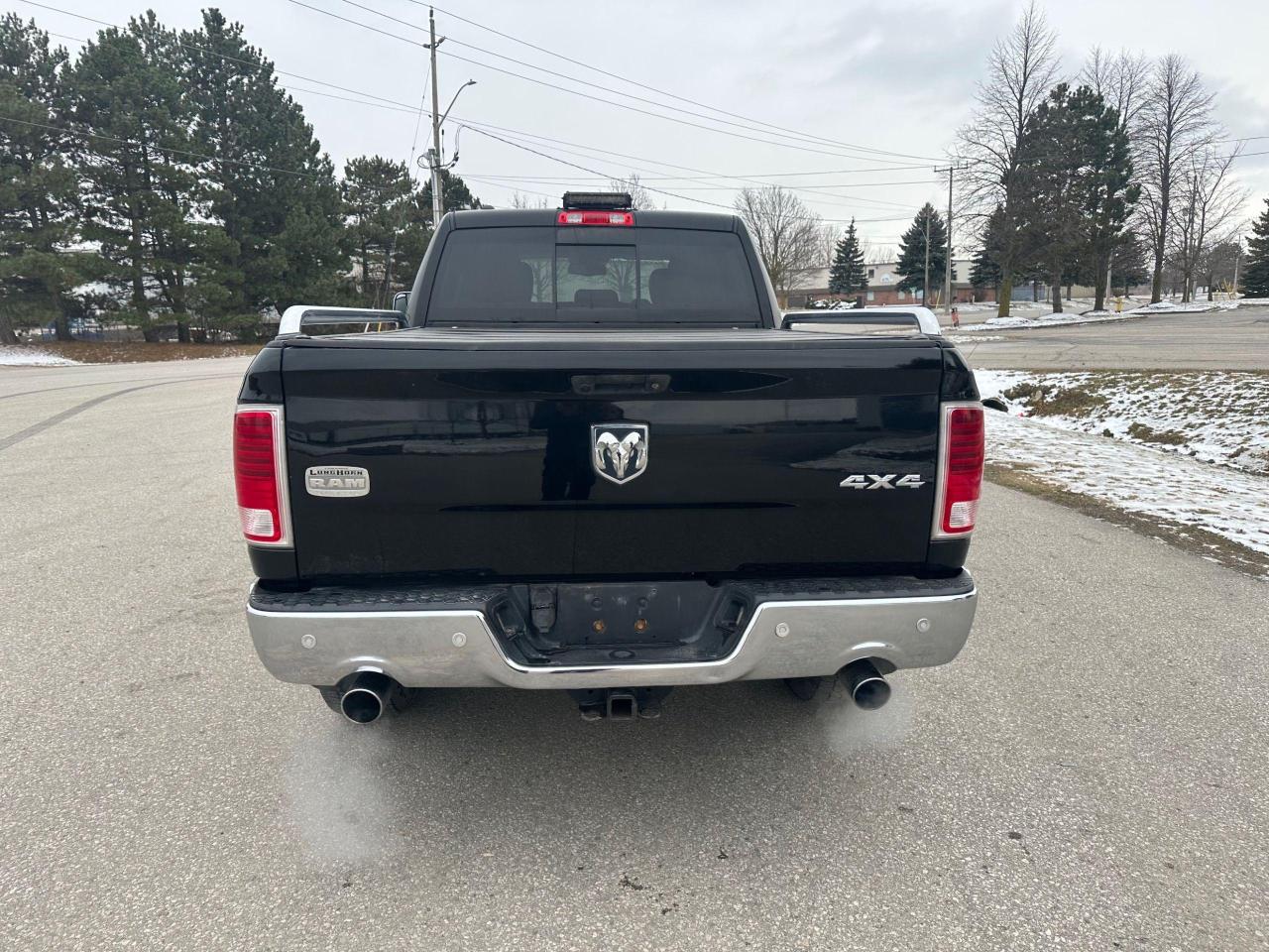 2014 RAM 1500 4WD Crew Cab 149" LARAMIE LONGHORN - Photo #9