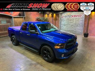 *** <strong>SPORTY BLUE STREAK PEARL BLACKOUT PKG! *** TONNEAU COVER, REMOTE START, SPRAY-IN LINER, STEP BARS!! *** TOYO OPEN COUNTRY TIRES, TOW PACKAGE, 20-INCH BLACKOUT WHEELS!!! *** </strong>Absolutely stunning colour combination - blue pearl with a black and grey two-tone interior... This Ram really pops!! Very well-maintained vehicle, beautiful shape inside and out, must be seen. Fitted with tons of factory upgrades like the <strong>PREFERRED PACKAGE </strong>(like a Sport Appearance Package) w/ Colour-Matched Bumpers, Grille & Front Fascia......<strong>FOG LIGHTS</strong>......Spray-In <strong>BEDLINER</strong>......<strong>TONNEAU COVER</strong>......<b>RUNNING BOARDS</b>......<strong>REMOTE START</strong>......Mud Flaps Front & Rear.....Power Heated Mirrors!! <strong>BLACKOUT PACKAGE </strong>w/ <strong>20X8 INCH SEMI GLOSS BLACK ALLOY RIMS</strong>......Blackout Headlights, Exterior Mirrors, Door Handles, Running Boards, Emblems! This sporty Ram is loaded with many more great features like a <strong>MULTIMEDIA TOUCHSCREEN </strong>w/ Bluetooth Connectivity......Locking Tailgate......<strong>BACKUP CAMERA</strong>......Steering Wheel Media & Cruise Controls......SiriusXM Ready......Box Lighting......Digital Vehicle Information Centre......Power Convenience Package (Windows, Locks, Mirrors)......Folding Rear Bench......<b>KEYLESS ENTRY</b>......Factory <strong>TOW PACKAGE </strong>w/ 4-Pin & 7-Pin Connectors......Tow/Haul Mode......Class IV Hitch Receiver......Auxiliary Transmission Oil Cooler......<strong>3.6L VVT V6 ENGINE</strong>......Factory Optioned <strong>8 SPEED AUTOMATIC TRANSMISSION</strong>......Electronic Shift on the Fly <strong>4X4/4WD </strong>w/ Lo & Lock......Traction Control......<strong>20 INCH BLACK ALLOYS</strong> w/ <strong>BIG TREAD TOYO A/T III TIRES</strong>!!<br /><br />This Stunner of a Ram 1500 comes with all Original Books & Manuals, two sets of Keys & Fobs, and Fitted All Weather Mats. Only 118,000 kms, now sale priced at just $33,800 with Financing & Extended Warranty available!!<br /><br /><br />Will accept trades. Please call (204)560-6287 or View at 3165 McGillivray Blvd. (Conveniently located two minutes West from Costco at corner of Kenaston and McGillivray Blvd.)<br /><br />In addition to this please view our complete inventory of used <a href=\https://www.autoshowwinnipeg.com/used-trucks-winnipeg/\>trucks</a>, used <a href=\https://www.autoshowwinnipeg.com/used-cars-winnipeg/\>SUVs</a>, used <a href=\https://www.autoshowwinnipeg.com/used-cars-winnipeg/\>Vans</a>, used <a href=\https://www.autoshowwinnipeg.com/new-used-rvs-winnipeg/\>RVs</a>, and used <a href=\https://www.autoshowwinnipeg.com/used-cars-winnipeg/\>Cars</a> in Winnipeg on our website: <a href=\https://www.autoshowwinnipeg.com/\>WWW.AUTOSHOWWINNIPEG.COM</a><br /><br />Complete comprehensive warranty is available for this vehicle. Please ask for warranty option details. All advertised prices and payments plus taxes (where applicable).<br /><br />Winnipeg, MB - Manitoba Dealer Permit # 4908