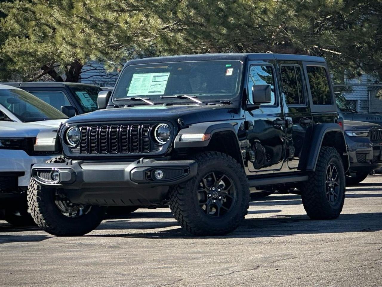 Ready to go wild, our New 2024 Jeep Wrangler Willys 4 Door 4X4 with the Convenience Pack is built for unbound adventure in Black! Motivated by a 3.6 Litre Pentastar V6 serving up 285hp matched to an 8 Speed Automatic transmission for trail-friendly strength. This Four Wheel Drive SUV also boasts Dana axles and a locking rear differential for leaving the pavement behind, and it achieves approximately 9.8L/100km on the highway. LED lighting, fog lamps, exclusive graphics, black alloy wheels, rock rails, a black grille, skid plates, and a body-color sport bar bring out the bold side of our Wrangler.

Our Willys cabin has a smart layout with our Convenience Pack. It adds heated cloth front seats, a heated-wrapped steering wheel, automatic climate control, a 7-inch driver display, remote start, and WiFi compatibility for enhanced comfort and convenience. Standard highlights include 12V power outlets, keyless access, cruise control, and a 12.3-inch touchscreen that supports Apple CarPlay®, Android Auto®, Bluetooth®, an eight-speaker audio system, and Off-Road Info Pages. Its time to pack up and pursue your dreams!

Jeep supplies key features for your safety, like a rearview camera, stability/traction control, hill-start assist, trailer-sway damping, tire-pressure monitoring, advanced airbags, ABS, and more. With benefits like those, our Wrangler Willys is an excellent choice for overcoming your next challenge! Save this Page and Call for Availability. We Know You Will Enjoy Your Test Drive Towards Ownership!