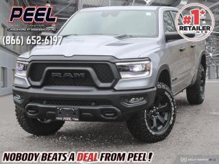 SHOWS LIKE NEW!!

2023 Ram 1500 Rebel Night Edition | Crew Cab 4X4 | Luxury Leather-faced Bucket Seats | RamBox Cargo Management System | Uconnect 12" Touchscreen Display w/ Navigation | 19-speaker Harman/Kardon Premium Sound | Heated Seats | Heated Steering Wheel | Remote Start | Active 4 corner Air Suspension | Multi Function Tailgate | Mopar Spray-in Bed Liner | Trailer Tow Group | Bed Utility Group | Level 2 Equipment Group | 

One Owner Clean Carfax

*** SET UP TO TOW UP TO 11,200 LBS | 5.7L HEMI V8 | 3.92 REAR AXLE | TRAILER BRAKE CONTROL | TRAILER TOW MIRRORS | TRAILER REVERSE STEERING CONTROL | CLASS IV HITCH RECEIVER ***

Meet the 2023 Ram 1500 Rebel Night Edition, a truck that defines power, style, and innovation. Fully loaded with an impressive array of features, this Rebel stands out with its Night Edition package, boasting bold aesthetics with blacked-out accents. Equipped with the Technology Group, Comfort and Convenience Group, Trailer Tow Group, Level 2 Equipment Group, and the Multi-Function Tailgate, it seamlessly blends advanced technology with unrivaled comfort and functionality. The Active 4 Corner Air Suspension ensures a smooth and adaptable ride, making every journey a pleasure. Safety takes the forefront with blind-spot monitoring, while the RamBox cargo management system and a spray-in bed liner add practicality and durability to your truck bed. For those who demand the best of everything, the 2023 Ram 1500 Rebel Night Edition is the pinnacle of capability, style, and innovation, ready to elevate your driving experience to new heights.
______________________________________________________

Engage & Explore with Peel Chrysler: Whether youre inquiring about our latest offers or seeking guidance, 1-866-652-6197 connects you directly. Dive deeper online or connect with our team to navigate your automotive journey seamlessly.

WE TAKE ALL TRADES & CREDIT. WE SHIP ANYWHERE IN CANADA! OUR TEAM IS READY TO SERVE YOU 7 DAYS! COME SEE WHY NOBODY BEATS A DEAL FROM PEEL! Your Source for ALL make and models used cars and trucks
______________________________________________________

*FREE CarFax (click the link above to check it out at no cost to you!)*

*FULLY CERTIFIED! (Have you seen some of these other dealers stating in their advertisements that certification is an additional fee? NOT HERE! Our certification is already included in our low sale prices to save you more!)

______________________________________________________

Peel Chrysler — A Trusted Destination: Based in Port Credit, Ontario, we proudly serve customers from all corners of Ontario and Canada including Toronto, Oakville, North York, Richmond Hill, Ajax, Hamilton, Niagara Falls, Brampton, Thornhill, Scarborough, Vaughan, London, Windsor, Cambridge, Kitchener, Waterloo, Brantford, Sarnia, Pickering, Huntsville, Milton, Woodbridge, Maple, Aurora, Newmarket, Orangeville, Georgetown, Stouffville, Markham, North Bay, Sudbury, Barrie, Sault Ste. Marie, Parry Sound, Bracebridge, Gravenhurst, Oshawa, Ajax, Kingston, Innisfil and surrounding areas. On our website www.peelchrysler.com, you will find a vast selection of new vehicles including the new and used Ram 1500, 2500 and 3500. Chrysler Grand Caravan, Chrysler Pacifica, Jeep Cherokee, Wrangler and more. All vehicles are priced to sell. We deliver throughout Canada. website or call us 1-866-652-6197. 

Your Journey, Our Commitment: Beyond the transaction, Peel Chrysler prioritizes your satisfaction. While many of our pre-owned vehicles come equipped with two keys, variations might occur based on trade-ins. Regardless, our commitment to quality and service remains steadfast. Experience unmatched convenience with our nationwide delivery options. All advertised prices are for cash sale only. Optional Finance and Lease terms are available. A Loan Processing Fee of $499 may apply to facilitate selected Finance or Lease options. If opting to trade an encumbered vehicle towards a purchase and require Peel Chrysler to facilitate a lien payout on your behalf, a Lien Payout Fee of $299 may apply. Contact us for details. Peel Chrysler Pre-Owned Vehicles come standard with only one key.
