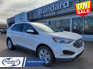 <b>Heated Seats,  Power Liftgate,  Apple CarPlay,  Android Auto,  Remote Start!</b><br> <br>  Compare at $32488 - Our Price is just $30177! <br> <br>   With luxury inside, and a bold, distinct style outside, the Ford Edge will stand out in the crowd as much as you do. This  2019 Ford Edge is for sale today in Swift Current. <br> <br>With impressive attention to detail, the Ford Edge seamlessly integrates power, performance and handling with awesome technology to help you multitask your way through the challenges that life throws your way. Made for an active lifestyle and spontaneous getaways, the Ford Edge is as rough and tumble as you are. Push the boundaries and stay connected to the road with this sweet ride!This  SUV has 82,792 kms. Its  oxford white in colour  . It has an automatic transmission and is powered by a  250HP 2.0L 4 Cylinder Engine.  It may have some remaining factory warranty, please check with dealer for details. <br> <br> Our Edges trim level is SEL. This Edge SEL comes with an impressive list of features including a power rear liftgate, power heated front seats, FordPass Connect with a 4G LTE hotspot, an 8 inch touchscreen featuring SYNC 3, Apple CarPlay and Android Auto, a leather wrapped steering wheel with audio and cruise controls, dual zone automatic climate control and remote keyless entry. For added safety and convenience, you will also get Ford Co-Pilot360 with blind spot assist, lane keep assist, automatic emergency braking, lane departure warning, a proximity key for push button start, automatic headlights, front fog lights, a remote start and a rear view camera with rear parking sensors. This vehicle has been upgraded with the following features: Heated Seats,  Power Liftgate,  Apple Carplay,  Android Auto,  Remote Start,  Blind Spot Assist,  Lane Keep Assist. <br> To view the original window sticker for this vehicle view this <a href=http://www.windowsticker.forddirect.com/windowsticker.pdf?vin=2FMPK4J99KBB18297 target=_blank>http://www.windowsticker.forddirect.com/windowsticker.pdf?vin=2FMPK4J99KBB18297</a>. <br/><br> <br>To apply right now for financing use this link : <a href=https://www.standardnissan.ca/finance/apply-for-financing/ target=_blank>https://www.standardnissan.ca/finance/apply-for-financing/</a><br><br> <br/><br>Why buy from Standard Nissan in Swift Current, SK? Our dealership is owned & operated by a local family that has been serving the automotive needs of local clients for over 110 years! We rely on a reputation of fair deals with good service and top products. With your support, we are able to give back to the community. <br><br>Every retail vehicle new or used purchased from us receives our 5-star package:<br><ul><li>*Platinum Tire & Rim Road Hazzard Coverage</li><li>**Platinum Security Theft Prevention & Insurance</li><li>***Key Fob & Remote Replacement</li><li>****$20 Oil Change Discount For As Long As You Own Your Car</li><li>*****Nitrogen Filled Tires</li></ul><br>Buyers from all over have also discovered our customer service and deals as we deliver all over the prairies & beyond!#BetterTogether<br> Come by and check out our fleet of 30+ used cars and trucks and 30+ new cars and trucks for sale in Swift Current.  o~o