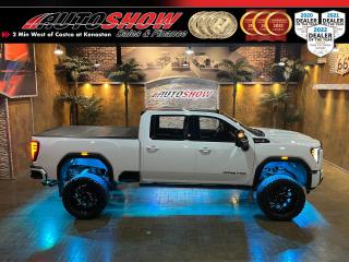 <strong>*** MASSIVE LIFTED GMC 2500HD DURAMAX AT4 SHOW TRUCK!! *** 6.5 INCH BDS LIFT, 37 X 13.5 NITTO GRAPPLERS, SUNROOF, HEATED/COOLED LEATHER!! *** REDESIGNED INTERIOR, 13.4 IN SCREEN!! *** </strong>Please note, an appointment is required to view this vehicle. Now this is a truck. Showstopper Lifted Diesel <strong>2500HD AT4</strong> in Summit White with over <strong>$20,000.00 </strong>in aftermarket upgrades!! New redesigned interior for 2024, and it. is. stunning!! The nicest, most refined interior on any <strong>GMC</strong> truck weve ever seen. Power? Hows <strong>975 FT/LBS TORQUE</strong>. Comfort? Here, hop into heated/cooled leather seats. Want to stand out? This is the truck for you. From the lift, to the under glow, to the 6 train horns, this 3/4 Ton is anything but subtle. Be the king of the road in this absolute beast of a rig. Make the dream truck of many your reality. No expense spared, tons of quality aftermarket upgrades including a <strong>6.5 INCH BDS LIFT KIT</strong>......<strong>22x10 FUEL RUNNER MACHINED ALLOY RIMS</strong>......<strong>37x13.5 NITTO RIDGE GRAPPLER TIRES</strong>......Colour-Changing <strong>LED ROCK & UNDERBODY LIGHTING</strong>......<strong>REV </strong>Hard Folding Tonneau Cover......6 Bed-Mounted <strong>AIR HORNS </strong>w/ Dual Compressors, Tank & Controls......<strong>MBRP </strong>Dual Chrome 5 Inch Exhaust Tips......Gorilla Spike Lug Nut Kit......Pro-Ryde Superblocks......Air Hawk 12-inch Angle Cut Mud Flaps!! This <strong>AT4 </strong>is absolutely loaded with factory options like a Beautiful 2-Tone Contrast-Stitched <strong>LEATHER INTERIOR</strong>......<strong>SUNROOF</strong>......<strong>HEADS-UP DISPLAY</strong>......<strong>13.4 INCH TOUCHSCREEN</strong>......Apple CarPlay & Android Auto......<strong>REMOTE START</strong>......<strong>BOSE PREMIUM STEREO </strong>w/ Subwoofer......<strong>POWER FOLDING RUNNING BOARDS</strong>......<strong>POWER ADJUSTABLE SEATS </strong>w/ Lumbar Support......<strong>HEATED STEERING WHEEL</strong>......<strong>A/C VENTILATED SEATS</strong>......Memory Seats......<strong>REAR HEATED SEATS</strong>......Spray-In <strong>BEDLINER</strong>......Collision Avoidance......Offroad <strong>SKID PLATES</strong>......Integrated Amazon Alexa Assistant......SiriusXM Satellite Radio......<strong>360-VIEW CAMERA</strong>......Push-Button Ignition......Lane Departure Alert......Parking Assist Sensors......Sport Buckets & Console......<b>LED </b>Marker & Taillights......<strong>HID </strong>Headlights......Dark Tinted Windows......Sport Colour-Matched Bumpers......Tow Hooks......Blackout Badging......Split-Folding Tailgate......Electronic Parking Brake......Dual Zone Automatic Climate Control......Electronic Shift on the Fly <strong>4X4/4WD</strong>......Fully Boxed Frame......Factory <strong>TOW PACKAGE </strong>w/ 4-Pin & 7-Pin Connectors......Tow/Haul Mode......Factory Integrated <strong>TRAILER BRAKE CONTROLLER</strong>......Exhaust Brake (Jake Brake)......Hill Descent Control......Beast of a <strong>6.6L DURAMAX DIESEL</strong>......Tough <strong>HD</strong> 10-Speed Allison Transmission......<strong>22x10 FUEL RUNNER MACHINED ALLOY RIMS</strong> Wrapped in <strong>37x13.5 NITTO RIDGE GRAPPLER TIRES!</strong><br /><br /><strong>PLEASE NOTE: AN APPOINTMENT IS REQUIRED TO VIEW THIS VEHICLE. </strong><br /><br />This monster 2500HD Four Wheel Drive comes with all original Books & Manuals, Remote Entry key fob, fitted All Weather Mats!<strong>! </strong>Only 19,000kms on this rig. Now sale priced at $122,800 with Financing & Extended Warranty available!<br /><br /><br />Will accept trades. Please call (204)560-6287 or View at 3165 McGillivray Blvd. (Conveniently located two minutes West from Costco at corner of Kenaston and McGillivray Blvd.)<br /><br />In addition to this please view our complete inventory of used <a href=\https://www.autoshowwinnipeg.com/used-trucks-winnipeg/\>trucks</a>, used <a href=\https://www.autoshowwinnipeg.com/used-cars-winnipeg/\>SUVs</a>, used <a href=\https://www.autoshowwinnipeg.com/used-cars-winnipeg/\>Vans</a>, used <a href=\https://www.autoshowwinnipeg.com/new-used-rvs-winnipeg/\>RVs</a>, and used <a href=\https://www.autoshowwinnipeg.com/used-cars-winnipeg/\>Cars</a> in Winnipeg on our website: <a href=\https://www.autoshowwinnipeg.com/\>WWW.AUTOSHOWWINNIPEG.COM</a><br /><br />Complete comprehensive warranty is available for this vehicle. Please ask for warranty option details. All advertised prices and payments plus taxes (where applicable).<br /><br />Winnipeg, MB - Manitoba Dealer Permit # 4908