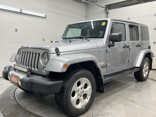 ONLY 89,000 KMS! SAHARA UNLIMITED 4x4 W/ 3.6L V6, BODY-COLOUR FREEDOM-TOP HARD TOP, HEATED SEATS, REMOTE START, NAVIGATION AND 18-IN ALLOYS! Premium 6.5-inch touchscreen, power windows, power locks, power mirrors, tow package, running boards, lever-style transfer case controls, Bluetooth, auto-dimming rearview mirror, full-sized spare tire, air conditioning, keyless entry, cruise control and Sirius XM!