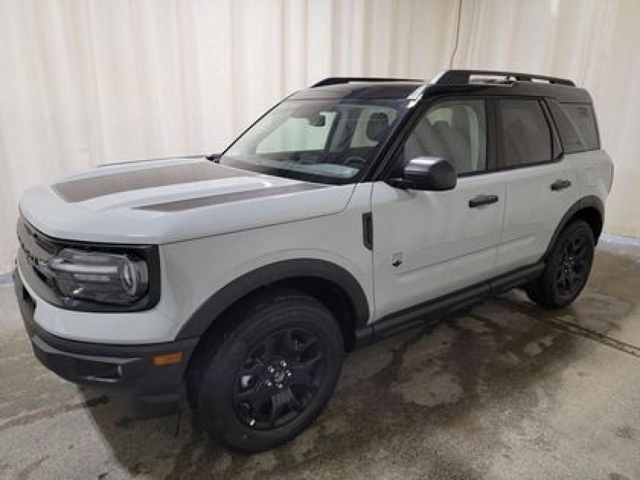 This all new 2024 Ford Bronco Sport Big Bend 200A looks absolutely stunning in Cactus Grey. This 5-passenger crossover comes with the 1.5L EcoBoost engine. This remarkable engine not only produces 181 horsepower and 190 ft pounds of torque, but by leveraging the EcoBoost technology and an 8-speed automatic transmission this crossover is rated it to get 8.9L 100/km (32 miles per gallon) combined highway/city fuel economy. 

Key Features:
Class II Trailer Tow Package
Black Appearance Package
Ford Co-Pilot360 Assist+
Convenience Package
Rear Parking Sensors 
Wireless Charging Pad 
LED Fog Lamps 
Universal Garage Door Opener 
Heated Front Seats
6-Way Power Drivers Seat
Push Button Start
Illuminated Door Entry Key Pad
SOS Post-Crash Alert System
LED Headlights, Fog Lights and Signature Lights
Ford Co-Pilot360®
17 Carbonized Grey-Painted High Gloss Aluminum
Auto High-Beam Headlamps
Blis® (Blind Spot Information System) with Cross-Traffic Alert
Lane Keeping System
Pre-Collision Assist W/Automatic Emergency Braking
AM/FM Six Speaker Sound System W/Sirius Satellite Radio
FordPass® Connect W/Remote Start
Electronic Climate Control
8 LCD touchscreen Center Stack
Terrain Management System
Automatic Climate Control
4X4
Remote Start
Mud Flaps

Saskatchewan has a challenging climate, but the Bronco Sport Big Bend is a tough SUV leverages physical features and technology that will keep you comfortable and safe. This specific vehicle is loaded right up and includes power windows, power locks, power mirrors, air conditioning, cruise, 8-way power drivers seat, heated sideview mirrors, heated front seats, 17 all terrain tires, intelligent access W/push-button start, privacy glass, tilt/telescopic steering column, AdvancedTrac® W/roll stability controlled taillights, rain-sensing windshield wipers, 4.2 screen in instrument cluster, outside temperature display, LED headlights, taillights and LED signature lighting, hill start assist, MyKey®, perimeter safety system four-wheel drive, front and rear stabilizer bar and so much more. 

Bennett Dunlop Ford has been located at 770 Broad St, in the heart of Regina for over 40 years! Our 4.6 Star google review (Well over 1,800 reviews) is the result of our commitment to providing the fastest, easiest and most fun customer experience possible. Our customers tell us that they love that we dont charge any admin or documentation fees, our sales team will simply offer our best price upfront and we have a no-questions-asked money back guarantee just in case you change your mind after your purchase.