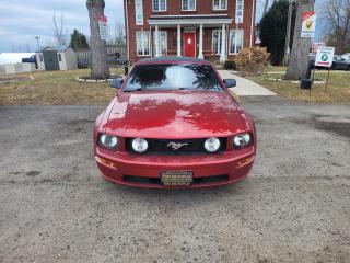 <div><span>2006 FORD MUSTANG GT DELUXE CONVERTIBLE (</span><b>4.6L V8 SOHC 24V) </b></div><br /><div><b>you cant ignore this red leather interior, its a bold statement, makes you stand out, this vehicle is in a such great shape, hard to find, you must see to appreciate. All the power options, newer tires with great thread, upgraded touch screen stereo system with Bluetooth option. </b></div><br /><div><span>Save time money, and frustration with our transparent, no hassle pricing. Using the latest technology, we shop the competition for you and price our pre-owned vehicles to give you the best value, upfront, every time and back it up with a free market value report so you know you are getting the best deal! With no additional fees, theres no surprises either, the price you see is the price you pay, just add HST! We offer 150+ Vehicles on site with financing for our customers regardless of credit. We have a dedicated team of credit rebuilding experts on hand to help you get into the car of your dreams. We need your trade-in! We have a hassle free top dollar trade process and offer a free evaluation on your car. We will buy your vehicle even if you do not buy one from us!<o:p></o:p></span></div><br /><div></div><br /><div><span>THAT CAR PLACE - Been in business for 27 years, we are OMVIC Certified and Member of UCDA earning your trust so you can buy with confidence.<br>150+ VEHICLES! ONE LOCATION!<br>USED VEHICLE MARKET PRICING! We use an exclusive 3rd party marketing tool that accurately monitors vehicle prices to guarantee our customers get the best value.<br>OUR POLICY!  Zero Pressure and Hassle-Free sales staff. Zero Hidden Admin Fees. Just honesty and integrity at no additional charge!<br>HISTORY: Free Carfax report included with every vehicle.<br>AWARDS:<br>National Dealer of the Year Winner of Outstanding Customer Satisfaction<br>Voted #1 Best Used Car Dealership in London, Ont. 2014 to 2024<br>Winner of Top Choice Award 6 years from 2015 to 2024<br>Winner of Londons Readers Choice Award 2014 to 2023<br>A+ Accredited Better Business Bureau rating<br>FULL SAFETY: Full safety inspection exceeding industry standards all vehicles go through an intensive inspection<br>RECONDITIONING: Any Pads or Rotors below 50% material will be replaced. You will receive a semi-synthetic oil-lube-filter and cleanup.<br>*Our Staff put in the most effort to ensure the accuracy of the information listed above. Please confirm with a sales representative to confirm the accuracy of this information*<br>**Payments are based off qualifying monthly term & 4.9% interest. Qualifying term and rate of borrowing varies by lender. Example: The cost of borrowing on a vehicle with a purchase price of $10000 at 4.9% over 60 month term is $1499.78. Rates and payments are subject to change without notice. Certified</span></div>