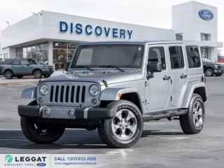 Finished in a Silver exterior that complements the Black cloth interior, standing on a set of 18-inch alloy wheels. Beneath the hood, you will reveal a 3.6L V6 engine paired with an automatic transmission layered with Jeeps 4x4 system. Slide into the interior and be impressed to find features including a panoramic sunroof, A/C, power windows, power door locks, power side mirrors, steering wheel-mounted controls, cruise control, traction control, AM/FM/SAT radio, Bluetooth, CD player, and so much more. What are you waiting for? Come in and experience this 2018 Jeep Wrangler Sahara 4x4!