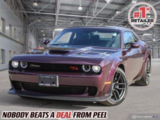 2022 Dodge Challenger Widebody Scat Pack 392 | 6.4L SRT Hemi V8 | 8spd Auto | Rare Colour - Hellraisin
LOADED | Heated & Vented Nappa Leather/Alcantara Faced vented seats | 6-Piston Brembo Brakes | Widebody Competition Suspension | 20x11 Devils Rim Forged Wheels
Plus Group | Driver Convenience Group | Harman/Kardon 18 Speaker Audio System | Power Sunroof | Blind Spot | Remote Start | Power Steering Column | 3.09 Rear Axle

One Owner Clean Carfax

Indulge in the thrill of owning a one-of-a-kind masterpiece  the 2022 Dodge Challenger Scat Pack 392 Widebody. Dressed in the mesmerizing Hellraisin hue, this Challenger commands attention at every turn with its striking presence. Inside, the luxurious Nappa leather/Alcantara seats, heated and ventilated for your comfort, envelop you in opulence as you prepare for the ride of a lifetime. But its not just about looks  this Challenger is built for performance, boasting the Widebody package with Brembo brakes, Widebody competition suspension, and 20x11 Devils Rim forged wheels, ensuring unparalleled handling and control on the road. And with additional features like the Plus Group, Driver Convenience Group, Harman/Kardon Sound Group, power sunroof, and Uconnect 4C NAV 8.4" screen, every journey becomes an unforgettable experience tailored to your desires. For the discerning enthusiast seeking their dream spec, the 2022 Dodge Challenger Scat Pack 392 Widebody beckons as the ultimate expression of power, luxury, and exclusivity.

This isnt just a car  its a rare opportunity to own a piece of automotive excellence crafted to fulfill your wildest dreams. From its captivating exterior to its meticulously appointed interior, every detail of the 2022 Dodge Challenger Scat Pack 392 Widebody speaks to the heart of the true enthusiast. Dont just settle for ordinary  seize the chance to elevate your driving experience to extraordinary heights with this exceptional specimen. Visit our dealership today and make your dream a reality with the Dodge Challenger Scat Pack 392 Widebody.
______________________________________________________

We have a fantastic selection of freshly traded vehicles ready for anyone looking to SAVE BIG $$$!!! Over 7 acres and 1000 New & Used vehicles in inventory!

WE TAKE ALL TRADES & CREDIT. WE SHIP ANYWHERE IN CANADA! OUR TEAM IS READY TO SERVE YOU 7 DAYS! COME SEE WHY NOBODY BEATS A DEAL FROM PEEL! Your Source for ALL make and models used cars and trucks
______________________________________________________

*FREE CarFax (click the link above to check it out at no cost to you!)*

*FULLY CERTIFIED! (Have you seen some of these other dealers stating in their advertisements that certification is an additional fee? NOT HERE! Our certification is already included in our low sale prices to save you more!)

______________________________________________________

Have you followed us on YouTube, Instagram and TikTok yet? We have Monthly giveaways to Subscribers!

Serving, Toronto, Mississauga, Oakville, Hamilton, Niagara, Kingston, Oshawa, Ajax, Markham, Brampton, Barrie, Vaughan, Parry Sound, Sudbury, Sault Ste. Marie and Northern Ontario! We have nearly 1000 new and used vehicles available to choose from.

Peel Chrysler in Mississauga, Ontario serves and delivers to buyers from all corners of Ontario and Canada including Toronto, Oakville, North York, Richmond Hill, Ajax, Hamilton, Niagara Falls, Brampton, Thornhill, Scarborough, Vaughan, London, Windsor, Cambridge, Kitchener, Waterloo, Brantford, Sarnia, Pickering, Huntsville, Milton, Woodbridge, Maple, Aurora, Newmarket, Orangeville, Georgetown, Stouffville, Markham, North Bay, Sudbury, Barrie, Sault Ste. Marie, Parry Sound, Bracebridge, Gravenhurst, Oshawa, Ajax, Kingston, Innisfil and surrounding areas. On our website www.peelchrysler.com, you will find a vast selection of new vehicles including the new and used Ram 1500, 2500 and 3500. Chrysler Grand Caravan, Chrysler Pacifica, Jeep Cherokee, Wrangler and more. All vehicles are priced to sell. We deliver throughout Canada. website or call us 1-866-652-6197. 

All advertised prices are for cash sale only. Optional Finance and Lease terms are available. A Loan Processing Fee of $499 may apply to facilitate selected Finance or Lease options. If opting to trade an encumbered vehicle towards a purchase and require Peel Chrysler to facilitate a lien payout on your behalf, a Lien Payout Fee of $299 may apply. Contact us for details. Peel Chrysler Pre-Owned Vehicles come standard with only one key.