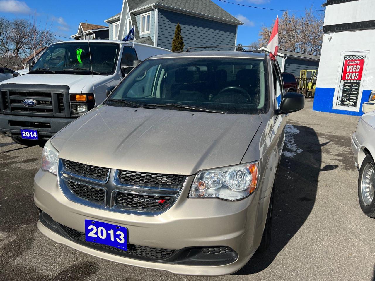 <p>Calling all families on the go! Malfaras Automotive is proud to offer this fantastic 2013 Dodge Grand Caravan SXT. This tan beauty comes equipped with everything you need for comfortable and safe adventures. With its spacious interior, versatile seating, and a reliable 3.6L 6-cylinder engine, this Grand Caravan is ready to tackle any journey. This pre-owned minivan is loaded with features that make it an excellent choice for families and anyone looking for a dependable, feature-rich vehicle.</p><p>The Grand Caravan SXT has only 131,102 km on the odometer and has been meticulously maintained. The comfortable black cloth interior features plenty of room for seven passengers, with a spacious third-row seat that folds down for ample cargo space. With its automatic transmission and front-wheel drive, it offers smooth handling and a comfortable ride, making every trip a breeze.</p><p>Ready to experience the comfort and convenience of the 2013 Dodge Grand Caravan SXT? Here are a few of its most impressive features:</p><ul><li><strong>3rd-Row Seating:</strong> This minivan offers ample space for the whole family, accommodating up to seven passengers. The third row easily folds down for additional cargo space when needed.</li><li><strong>Power Everything:</strong> The Grand Caravan SXT is equipped with power door locks, power mirrors, and power windows for added convenience and comfort.</li><li><strong>Heated Mirrors:</strong> Stay safe and comfortable in the winter with the heated mirrors, which provide a clear view even on cold mornings.</li><li><strong>Cruise Control:</strong> Enjoy a relaxing driving experience with the cruise control feature, especially on long road trips.</li><li><strong>Keyless Entry:</strong> This Grand Caravan SXT features keyless entry, making it easy and convenient to access your vehicle.</li></ul><p><em>Powered by AutoIntelligence™ AI</em></p>