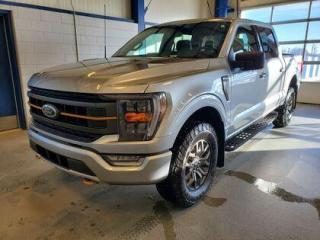 This all new redesigned 2022 Ford F-150 Tremor 401A looks absolutely stunning in Iconic Silver Metallic. This truck comes with the ever popular 3.5L EcoBoost engine. This remarkable engine not only produces 400 horsepower and 500 ft pounds of torque, but by leveraging the EcoBoost technology and a 10-speed automatic transmission this truck is rated it to get 13.3L 100/km (21 miles per gallon) combined highway/city fuel economy. This 4-wheel drive truck also has a 10,900 lbs. towing capacity.

Key Features:
Interior Work Surface 
Wheel Well Liner
8 LCD Touchscreen 
Heated Front Seats
LED Fog Lights
LED Reflector Headlamps
Apple Car Play/Android Auto 
Reverse Sensing System W/ Back-Up Camera
18 Dark Matte Finished Wheels
Ford Co-Pilot 2.0
FordPass Connect 
4G Wi-Fi Modem 
Dual Rear Exhaust
Pre-Collision Assist with Automatic Emergency Braking
MyKey 4 LCD Productivity Screen (In Gauge Cluster) 
Keyless Entry Keypad 
Hill Start Assist
Trailer Sway Control
Lane Keeping System 
Outside Temperature Display
BLIS Pre-Collision Assist
4X4

Saskatchewan has a rough climate, but the F150 Tremor is a tough pickup that leverages physical features and technology that will keep you comfortable and safe. This F-150 Tremor comes very well equipped and includes 18 dark matte finished wheels, all terrain tires, heated front seats, LED fog lights, LED reflector headlamps, fog lights, Ford Pass, reverse sensing system, back-up camera, Bluetooth, BLIS (blind spot information system), lane keeping assist, post collision braking, trailer sway control, air conditioning, cruise control, power tailgate lock, air condition, tilt, power window, locks and mirrors and so much more. 

Moose Jaw Ford is located at 1010 North Service Road, Moose Jaw. You can buy with confidence at Moose Jaw Ford, thanks to our Moose Jaw Motives. Take the uneasiness out of purchasing a vehicle whether you are buying a new or a fully reconditioned and inspected pre-owned vehicle with our 30-day exchange policy. If you're not completely satisfied with your vehicle purchase, just bring it back and exchange it for a vehicle you'll love. At Moose Jaw Ford, we're driving change all across Saskatchewan! We are Moose Jaw's prime destination for everything automotive. We pride ourselves by consistently providing the highest quality customer experience.