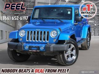 2016 Jeep Wrangler Unlimited Sahara | 3.6L Pentastar V6 | Hydro Blue Pearl | Heated Leather Seats | Body Colour Hard Top | Alpine Premium Audio System | Remote Start | 6.5" Touchscreen w/ NAV | Bluetooth 

One Owner

Introducing the rugged and versatile 2016 Jeep Wrangler Unlimited Sahara  a true icon in off-road capability and style. This particular model is loaded with premium features that elevate your driving experience to new heights. Sink into the comfort of heated leather seats as you embark on your next adventure, while the 6.5" touchscreen with navigation guides you effortlessly to your destination. Immerse yourself in crystal-clear sound with the Alpine premium audio system, and enjoy the convenience of remote start, allowing you to warm up your Wrangler before you even step outside. The connectivity group ensures seamless integration with your mobile devices, keeping you connected wherever you go. Plus, the body-color hardtop adds a touch of sophistication to the rugged exterior, perfectly complementing the striking Hydro Blue Pearl paint. Whether youre tackling rugged trails or cruising the city streets, the 2016 Jeep Wrangler Unlimited Sahara is ready for anything. Visit our dealership today and experience the thrill of driving a Jeep firsthand.
______________________________________________________

We have a fantastic selection of freshly traded vehicles ready for anyone looking to SAVE BIG $$$!!! Over 7 acres and 1000 New & Used vehicles in inventory!

WE TAKE ALL TRADES & CREDIT. WE SHIP ANYWHERE IN CANADA! OUR TEAM IS READY TO SERVE YOU 7 DAYS! COME SEE WHY NOBODY BEATS A DEAL FROM PEEL! Your Source for ALL make and models used cars and trucks
______________________________________________________

*FREE CarFax (click the link above to check it out at no cost to you!)*

*FULLY CERTIFIED! (Have you seen some of these other dealers stating in their advertisements that certification is an additional fee? NOT HERE! Our certification is already included in our low sale prices to save you more!)

______________________________________________________

Have you followed us on YouTube, Instagram and TikTok yet? We have Monthly giveaways to Subscribers!

Serving, Toronto, Mississauga, Oakville, Hamilton, Niagara, Kingston, Oshawa, Ajax, Markham, Brampton, Barrie, Vaughan, Parry Sound, Sudbury, Sault Ste. Marie and Northern Ontario! We have nearly 1000 new and used vehicles available to choose from.

Peel Chrysler in Mississauga, Ontario serves and delivers to buyers from all corners of Ontario and Canada including Toronto, Oakville, North York, Richmond Hill, Ajax, Hamilton, Niagara Falls, Brampton, Thornhill, Scarborough, Vaughan, London, Windsor, Cambridge, Kitchener, Waterloo, Brantford, Sarnia, Pickering, Huntsville, Milton, Woodbridge, Maple, Aurora, Newmarket, Orangeville, Georgetown, Stouffville, Markham, North Bay, Sudbury, Barrie, Sault Ste. Marie, Parry Sound, Bracebridge, Gravenhurst, Oshawa, Ajax, Kingston, Innisfil and surrounding areas. On our website www.peelchrysler.com, you will find a vast selection of new vehicles including the new and used Ram 1500, 2500 and 3500. Chrysler Grand Caravan, Chrysler Pacifica, Jeep Cherokee, Wrangler and more. All vehicles are priced to sell. We deliver throughout Canada. website or call us 1-866-652-6197. 

All advertised prices are for cash sale only. Optional Finance and Lease terms are available. A Loan Processing Fee of $499 may apply to facilitate selected Finance or Lease options. If opting to trade an encumbered vehicle towards a purchase and require Peel Chrysler to facilitate a lien payout on your behalf, a Lien Payout Fee of $299 may apply. Contact us for details. Peel Chrysler Pre-Owned Vehicles come standard with only one key.