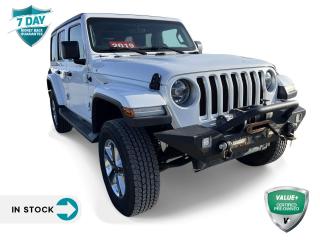 <p><strong>Embark on Elegance and Adventure: The 2019 Jeep Wrangler Unlimited Sahara 4x4</strong></p>

<p>Where the 2019 Jeep Wrangler Unlimited Sahara 4x4 awaits. Dressed in a striking Bright White and paired with a sophisticated Black interior featuring leather-faced bucket seats adorned with the Sahara logo, this model sets a new standard for rugged luxury.</p>

<p><strong>Exterior Charisma and Interior Comfort</strong></p>

<p>The Jeep Wrangler Unlimited Sahara's Bright White exterior is perfectly complemented by its black door handles and the iconic Black Jeep Freedom Top hardtop, making a statement of both elegance and adventure. Inside, the vehicle welcomes occupants with luxurious leather-faced bucket seats, ensuring comfort no matter where your journey takes you.</p>

<p><strong>Performance without Compromise</strong></p>

<p>Powered by the robust 3.6L Pentastar VVT V6 engine equipped with Stop-Start technology and an 8-speed automatic transmission, the Sahara model is designed for efficiency and performance. The 2.72:1 Command-Trac part-time 4x4 system and high-performance skid plates ensure that you're prepared for any terrain, while the Dana M220 rear axle provides unmatched durability and strength.</p>

<p><strong>Technological Sophistication</strong></p>

<p>Technology and convenience are at the forefront in the Wrangler Unlimited Sahara. With the Uconnect 4 with a 7-inch display, Apple CarPlay capability, and Google Android Auto, staying connected and entertained is effortless. Additionally, the Cold Weather Group and LED Lighting Group optional packages enhance both comfort and visibility for all your adventures.</p>

<p>The 2019 Jeep Wrangler Unlimited Sahara 4x4 is more than a vehicle; it's a statement. With its unmatched blend of luxury, technology, and rugged capability, it invites you to redefine adventure. Visit [Dealership Name] today and discover how the Jeep Wrangler Unlimited Sahara can elevate your driving experience to new heights. Embark on your next adventure with confidence and style.</p>

<form> </form>
<p> </p>

<h4>VALUE+ CERTIFIED PRE-OWNED VEHICLE</h4>

<p>36-point Provincial Safety Inspection<br />
172-point inspection combined mechanical, aesthetic, functional inspection including a vehicle report card<br />
Warranty: 30 Days or 1500 KMS on mechanical safety-related items and extended plans are available<br />
Complimentary CARFAX Vehicle History Report<br />
2X Provincial safety standard for tire tread depth<br />
2X Provincial safety standard for brake pad thickness<br />
7 Day Money Back Guarantee*<br />
Market Value Report provided<br />
Complimentary 3 months SIRIUS XM satellite radio subscription on equipped vehicles<br />
Complimentary wash and vacuum<br />
Vehicle scanned for open recall notifications from manufacturer</p>

<p>SPECIAL NOTE: This vehicle is reserved for AutoIQs retail customers only. Please, No dealer calls. Errors & omissions excepted.</p>

<p>*As-traded, specialty or high-performance vehicles are excluded from the 7-Day Money Back Guarantee Program (including, but not limited to Ford Shelby, Ford mustang GT, Ford Raptor, Chevrolet Corvette, Camaro 2SS, Camaro ZL1, V-Series Cadillac, Dodge/Jeep SRT, Hyundai N Line, all electric models)</p>

<p>INSGMT</p>