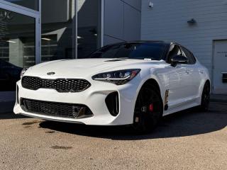 Look great and feel even better behind the wheel of our 2021 Kia Stinger GT Limited that looks incredible in Snow White Pearl! Its is powered by a Turbocharged 3.3 Liter V6 engine that produces 365 horsepower while paired with an 8-Speed Automatic transmission. It looks incredible with stunning black alloy wheels, a gloss black roof, LED headlights, and titanium chrome trimming.Inside our GT Limited, find a world of comfort and convenience with red leather seats, driver memory settings, front/rear heated seats, a leather-wrapped heated steering wheel that has mounted audio/cruise controls (adaptive), and a power sunroof. It also has navigation, dual-zone climate control, an AM/FM radio thats XM radio ready, USB/AUX inputs for mobile devices, and an impressive 9 speaker sound system.Our Kia gives you peace of mind with a variety of safety features including a 360-degree backup camera, a blind-spot/lane departure monitoring system, forward collision warning, stability/traction control, 4-Wheel anti-locking braking system, a multitude of airbags and more! Print this page and call us Now... We Know You Will Enjoy Your Test Drive Towards Ownership! We look forward to showing you why Go Mazda is the best place for all your automotive needs.Go Mazda is an AMVIC licensed business.Clean CarFax