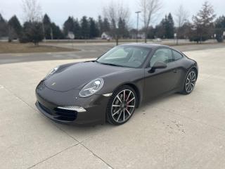<p>Low mileage Ontario car from new.</p><p>3.8 litre 6 cylinder normally aspirated engine with 400 horsepower and a breathtaking 7500 rpm redline.</p><p>$137K MSRP loaded with options including PDK transmission, heated and cooled 14 way seats, Bose audio, power sunroof, upgraded rims, sport chrono package.</p><p>Full frontal PPF protection including mirrors. <span id=jodit-selection_marker_1709050733032_9995307166710492 data-jodit-selection_marker=start style=line-height: 0; display: none;></span>Never seen salt. Two sets of Pirelli tires. Service records included.</p><table><tbody><tr><td>VIN:</td><td><strong>WP0AB2A99CS122260</strong></td></tr><tr><td>Price:</td><td>$137,150.00</td></tr><tr><td>Exterior:</td><td>Anthracite Brown Metallic</td></tr><tr><td>Interior:</td><td>Agate / Pebble Grey leather int</td></tr><tr><td><br></td><td><br></td></tr></tbody></table><table><tbody><tr><td><br></td><td><br></td></tr><tr><td>022</td><td>Instrument Dials in Black</td></tr><tr><td>250</td><td>Porsche Doppelkupplung (PDK)</td></tr><tr><td>427</td><td>20-inch Carrera Classic wheel</td></tr><tr><td>636</td><td>ParkAssist (front and rear)</td></tr><tr><td>640</td><td>Sport Chrono Package</td></tr><tr><td>651</td><td>Electric sunroof</td></tr><tr><td>658</td><td>Power Steering Plus</td></tr><tr><td>671</td><td>Voice Control</td></tr><tr><td>672</td><td>Navigation Module</td></tr><tr><td>840</td><td>SportDesign steering wheel</td></tr><tr><td>911</td><td>Model Designation 911</td></tr><tr><td>970</td><td>Two-tone leather interior</td></tr><tr><td>BV</td><td>Agate Grey / Pebble Grey leather interior</td></tr><tr><td>G0</td><td>Anthracite Brown Metallic</td></tr><tr><td>P06</td><td>Power Sport Seats (14-way)</td></tr><tr><td>P37</td><td>BOSE® Audio Package</td></tr><tr><td>XSC</td><td>Porsche Crest on headrests</td></tr></tbody></table> <p>** Appointments are mandatory as most of our inventory is stored off site ** Unless stated otherwise all our vehicles come Ontario Safety Certified with a 30 day Dealer guarantee as well as a complimentary Carfax report. There are no hidden fees. Competitive financing rates are available for most of our vehicles and extended warranties are also available through Lubrico Canada. You can find us at 12993 Steeles Avenue, Halton Hills, just west of Trafalgar Road near the Toronto Premium Outlet Mall. Located beside Mississauga, we are easily accessed from the Trafalgar Road exit of Hwy 401. We have been proudly serving the GTA area including Milton, Georgetown, Halton Hills, Acton, Erin, Brampton Mississauga, Toronto, and the surrounding areas for over 20 years. Please visit or website at www.bulletproofauto.ca for videos of our inventory. If we dont have exactly what youre looking for, we will find it. Also please take the time to research our Google and Facebook reviews. We pride ourselves in exceptional customer service and will always strive to provide our customers with a unique and personal car buying experience.  Bulletproof Auto Sales. Aim Higher.<span id=jodit-selection_marker_1682346445326_9978056229470107 data-jodit-selection_marker=start style=line-height: 0; display: none;></span></p>
