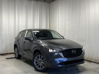 <p>NEW 2024 CX-5 GT AWD. Bluetooth, Skyactiv-G 2.5 L (Inline-4) Cylinder Deactivation. Backup Cam, NAV, Leather Heated/Ventilated Seats, Power Front Seats, Memory Driver Seat, Rear Heated Seats, Wireless Apple CarPlay/Android Auto, Wireless Phone Charger, Bose Premium Sound System, Advanced Keyless Remote Entry, Tilt/Sliding Moonroof, Power Trunk, Adaptive Cruise Control, Heated Steering Wheel, Wiper Blade De-Icer, Auto Dual-Zone Climate Control, Rear Air Vents, Auto Rain-Sensing Wipers, Electronic Parking Brake, Heated Mirrors, 19 Silver Metallic Alloy Wheels</p>  <p>Includes:</p> <p>i-ACTIVSENSE + Safety Features (Smart City Brake Support-Front, Rear Cross Traffic Alert, Mazda Radar Cruise Control With Stop & Go, Distance Recognition Support System, Lane-Keep Assist System, Lane Departure Warning System, Advanced Blind Spot Monitoring)</p>  <p>A joy to drive, our 2024 Mazda CX-5 GT AWD radiates refined style in Machine Grey Metallic! Motivated by a 2.5 Liter 4 Cylinder that delivers 187hp tethered to a paddle-shifted 6 Speed Automatic transmission. You can put that strength to good use with the added traction of torque vectoring, and this All Wheel Drive SUV returns nearly approximately 7.8L/100km on the highway. Our CX-5 also has an expressive design with bold details like 19-inch alloy wheels, a rear roof spoiler, and bright-tipped dual exhaust outlets.</p>  <p>Our GT cabin is no ordinary interior. Its tailor-made for better travel with heated leather power front seats, a leather-wrapped steering wheel, automatic climate control, pushbutton ignition, and keyless access. Mazda makes connecting easy by providing a 10.25-inch central display, a multifunction Commander controller, Apple CarPlay/Android Auto, Bluetooth, voice control, and six-speaker audio. The versatile rear cargo space adds adventure-friendly functionality.</p>  <p>Safety is a high priority for Mazda, which helps protect you and your loved ones with automatic emergency braking, adaptive cruise control, a rearview camera, lane-keeping assistance, blind-spot monitoring, and other intelligent technologies. With all that, our CX-5 GT is here to transcend the ordinary! Save this page, Come in for a Qualified Test Drive. We Know You Will Enjoy Your Test Drive Towards Ownership!</p>  <p>Call 587-409-5859 for more info or to schedule an appointment! Listed Pricing is valid for 72 hours. Financing is available, please see dealer for term availability and interest rates. AMVIC Licensed Business.</p>
