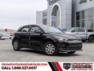 <b>Sunroof,  Heated Steering Wheel,  Blind Spot Detection,  Apple CarPlay,  Android Auto!</b><br> <br> Welcome to Crowfoot Dodge, Calgarys New and Pre-owned Superstore proudly serving Albertans for 44 years!<br> <br> Compare at $27995 - Our Price is just $25995! <br> <br>   New Arrival! This  2022 Kia Rio is fresh on our lot in Calgary. <br> <br>This  hatchback has 56,472 kms. Stock number 10653 is black in colour  . It has a cvt transmission and is powered by a  smooth engine. <br> <br> Our Rios trim level is LX Premium. This LX Premium takes the confident and smooth Rio5 even further with a sunroof, heated steering wheel, blind spot detection, and aluminum wheels. This Rio 5 has more tech than you expect like an 8 inch display with wireless Android Auto and Apple CarPlay, Bluetooth, and steering wheel controls. Heated seats offer comfort while remote keyless entry, cruise control, heated power side mirrors, easy and convenient cargo space, and a very handy rearview camera offer endless convenience. This vehicle has been upgraded with the following features: Sunroof,  Heated Steering Wheel,  Blind Spot Detection,  Apple Carplay,  Android Auto,  Heated Seats,  Remote Keyless Entry. <br> <br/><br> Buy this vehicle now for the lowest bi-weekly payment of <b>$169.33</b> with $0 down for 96 months @ 7.99% APR O.A.C. ( Plus GST      / Total Obligation of $35221  ).  See dealer for details. <br> <br>At Crowfoot Dodge, we offer:<br>
<ul>
<li>Over 500 New vehicles available and 100 Pre-Owned vehicles in stock...PLUS fresh trades arriving daily!</li>
<li>Financing and leasing arrangements with rates from prime +0%</li>
<li>Same day delivery.</li>
<li>Experienced sales staff with great customer service.</li>
</ul><br><br>
Come VISIT us today!<br><br> Come by and check out our fleet of 80+ used cars and trucks and 180+ new cars and trucks for sale in Calgary.  o~o