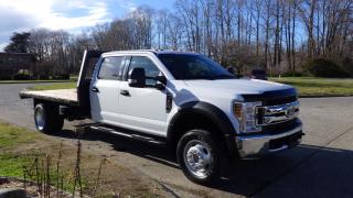 2019 Ford F-550 Crew Cab 11 Foot FlatDeck 4WD, 6.8L V10 SOHC 30V engine, 4 door, 4WD, cruise control, air conditioning, power door locks, power windows, power mirrors, white exterior. Measurements : Deck length is 11.5 Foot, Width is 8 Foot. Certification and Decal valid until February 2025. $56,810.00 plus $375 processing fee, $57,185.00 total payment obligation before taxes.  Listing report, warranty, contract commitment cancellation fee, financing available on approved credit (some limitations and exceptions may apply). All above specifications and information is considered to be accurate but is not guaranteed and no opinion or advice is given as to whether this item should be purchased. We do not allow test drives due to theft, fraud and acts of vandalism. Instead we provide the following benefits: Complimentary Warranty (with options to extend), Limited Money Back Satisfaction Guarantee on Fully Completed Contracts, Contract Commitment Cancellation, and an Open-Ended Sell-Back Option. Ask seller for details or call 604-522-REPO(7376) to confirm listing availability.