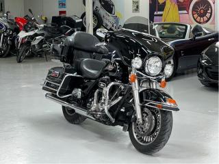 <p>Now with 7.99 % bank financing, oac.</p><p>2 owners from new, with a long list of Harley accessories. This bike is a great two up touring machine. The handling, power & comfort compared to pre-2009 touring bikes is incredible. The new frame means no more wallowing through high speed turns or worrisome tracking on rain grooves or metal bridges. The tranny is so much tighter and precise. With ABS, six gallon tank, oil cooler and cruise control, you can ride long distances and this bike just asks for more. With more features like a spacious Tour-Pak® carrier, a Harmon/Kardon® Advanced Audio System and fine Harley-Davidson styling detail, the Electra Glide® Classic model brings a level of luxury to touring adventures. The innovative Harley-Davidson® Touring chassis is based on a single-spar, rigid backbone frame and a stout swingarm developed to withstand the demands of long-haul touring riders and todays powerful engines.<br /><br />Harley-Davidson FLHTC Electra Glide Classic Model Highlights<br /><br />NEW for 2011 Security Package Option including factory-installed Harley-Davidson® Smart Security System with hands-free fob and Anti-lock Braking System (ABS), Sculpted seat for added comfort and easier straddling<br /><br />o Black powder-coated powertrain with chrome covers<br />o Chrome 2-1-2 dual exhaust with tapered mufflers<br />o Black, 28-spoke Cast Aluminum wheels with whitewall tires<br />o Bat-wing, fork-mounted fairing with clear, Lexan® windshield<br />o Chrome, low-profile fuel tank console<br />o Deep FL front fender with trim<br />o Stainless steel, easy-reach touring handlebar<br />o One-piece, two-up Electra Glide® classic comfort stitch seat<br />o Passenger backrest with wrap-around armrests<br />o Injection-molded hard saddlebags; 2.26 cu. ft. volume<br />o Injection Molded Tour-Pak®; 2.26 cu. ft. volume<br />o Fairing-mounted electronic speedometer and tachometer plus fuel, voltage, oil pressure and ambient air temperature gauges<br />o 40-watt, two-speaker Advanced Audio System by Harman/Kardon<br />o LED rear fender tip light<br />o Auxiliary passing lights<br /><br /><br /><br />2 Owners from new.</p>