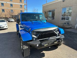 <p>Check out the colour, Hydro Blue Pearl. Matching removeable roof, soft top included. Original owner Unlimited Sahara with heated leather seats, Navigation, Factory remote stary, Chrome finished wheels, New BFG All Terrain tires, comes fully Certified with a Dealer Guarantee.</p><p>Why Buy From Us. Since 1991, Our Family commitment to each and every person has been to provide an exceptional level of customer service. From our knowledge in the industry and formed relationships we search for the cleanest, lowest kilometers vehicles while keeping our overhead costs low to save you money. We are part of a large Dealer Network with access to New Car Dealer trade-ins, we attend multiple weekly auctions and have our own trade-ins to provide a comprehensive lineup of all makes & models. After the sale, we welcome you back for any and all of your automotive needs; from regular service, to maintenance, tires & tire storage, detailing, dent removal, windshield chip repair or replacement we have the right tools and skilled workers to get the job done. We invite you to come in for a truly enjoyable car buying experience.</p><p>We offer; Preferred Dealer Bank financing available right here On Approved Credit. A Dealer Guarantee with every Certified vehicle, Free CARFAX Canada Vehicle History Report. We are a proud member of UCDA and maintain A+ Better Bureau Standing. Price plus HST & license</p>