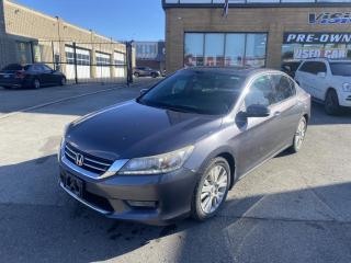 2014 Honda Accord Touring, a Great V6 Commuter Sedan !<br><br>GREAT CONDITION, this 2014 Honda Accord comes with a 3.5 LITER 6 CYLINDER MOTOR that puts out 278 HORSEPOWER.<br><br>Interior includes: LEATHER HEATED SEATS, SUNROOF, and a GREAT SOUNDING STEREO SYSTEM.<br><br>Well reviewed:  The 2014 Honda Accord earns top honors in the midsize sedan class with its mix of excellent packaging, superb fuel economy and rewarding performance,  (edumunds.com).<br><br> The 2014 Honda Accord is a good midsize car . Its cabin features upscale materials, an intuitive dashboard layout, and an easy-to-read display. The seats are comfortable and roomy for all occupants. In fact, the Accord   s back seats are some of the roomiest in the class. Trunk space is decent, but the lack of a split-folding rear seat makes carrying longer items impossible when you have rear-seat passengers. The Honda Accord   s agile handling makes it ideal for drivers who prefer fun over comfort. It also returns good fuel economy estimates,  (cars.usnews.com).<br><br>Driving aids include: BACK UP CAMERA, BLIND SPOT CAMERA (PASSENGER SIDE), and NAVIGATION.<br><br>This car has safety included in the advertised price.<br><br>Please Note: HST and Licensing is an additional fee separate from the advertised price. <br><br>We have a strong confidence in our cars, if you want to have a car inspected, Vision Fine Cars welcomes it.<br>  <br>Certain Crypto-Currency accepted as payment, Charges will apply.<br>