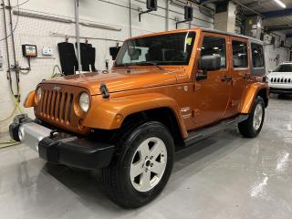 ONLY 115,000 KMS!! RARE MANGO TANGO PEARL 4-DR SAHARA UNLIMITED V6 W/ FREEDOM TOP HARDTOP! Running boards, 18-inch alloys, keyless entry, automatic headlights, full-sized spare tire, tow package, power windows, power locks, power mirrors, air conditioning, fog lights, lever-style transfer case controls and more! This vehicle just landed and is awaiting a full detail and photo shoot. Contact us and book your road test today!
