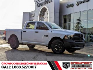 <b>Low Mileage, Heavy Duty Suspension,  Tow Package,  Power Mirrors,  Rear Camera!</b><br> <br> Welcome to Crowfoot Dodge, Calgarys New and Pre-owned Superstore proudly serving Albertans for 44 years!<br> <br> Compare at $47995 - Our Price is just $41995! <br> <br>   Get the job done right with this rugged Ram 1500 Classic pickup. This  2023 Ram 1500 Classic is for sale today in Calgary. <br> <br>The reasons why this Ram 1500 Classic stands above its well-respected competition are evident: uncompromising capability, proven commitment to safety and security, and state-of-the-art technology. From its muscular exterior to the well-trimmed interior, this 2023 Ram 1500 Classic is more than just a workhorse. Get the job done in comfort and style while getting a great value with this amazing full-size truck. This low mileage  Crew Cab 4X4 pickup  has just 1,247 kms. Stock number 10658 is white in colour  . It has a 8 speed automatic transmission and is powered by a  305HP 3.6L V6 Cylinder Engine. <br> <br> Our 1500 Classics trim level is Tradesman. This Ram 1500 Tradesman is ready for whatever you throw at it, with a great selection of standard features such as class II towing equipment including a hitch, wiring harness and trailer sway control, heavy-duty suspension, cargo box lighting, and a locking tailgate. Additional features include heated and power adjustable side mirrors, UCconnect 3, cruise control, air conditioning, vinyl floor lining, and a rearview camera. This vehicle has been upgraded with the following features: Heavy Duty Suspension,  Tow Package,  Power Mirrors,  Rear Camera. <br> <br/><br> Buy this vehicle now for the lowest bi-weekly payment of <b>$273.55</b> with $0 down for 96 months @ 7.99% APR O.A.C. ( Plus GST      / Total Obligation of $56899  ).  See dealer for details. <br> <br>At Crowfoot Dodge, we offer:<br>
<ul>
<li>Over 500 New vehicles available and 100 Pre-Owned vehicles in stock...PLUS fresh trades arriving daily!</li>
<li>Financing and leasing arrangements with rates from prime +0%</li>
<li>Same day delivery.</li>
<li>Experienced sales staff with great customer service.</li>
</ul><br><br>
Come VISIT us today!<br><br> Come by and check out our fleet of 80+ used cars and trucks and 130+ new cars and trucks for sale in Calgary.  o~o