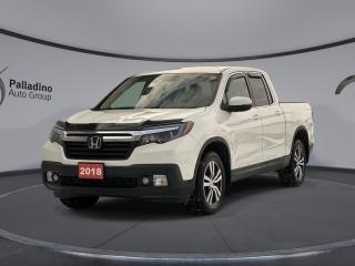 <b>Sunroof,  Leather Seats,  Bluetooth,  Adaptive Cruise Control,  Rear View Camera!</b><br> <br>    The 2018 Honda Ridgelines roomy cabin, ample storage, smooth ride, and innovative touches make its rivals seem outdated. This  2018 Honda Ridgeline is for sale today in Sudbury. <br> <br>Honda threw out the rulebook with the latest version of the Ridgeline and made a totally unconventional pickup truck. It has all the utility of a pickup combined with car-like ride quality. Its unique unibody design gives it excellent road manners and a smooth ride while maintaining the hard-working functionality of a truck. Theres never been a pickup thats easier to drive, packed with quirks, versatility, and character making the 2018 Honda Ridgeline one of a kind. This  Crew Cab 4X4 pickup  has 80,868 kms. Its  white diamond in colour  . It has an automatic transmission and is powered by a  3.5L V6 24V GDI SOHC engine.  It may have some remaining factory warranty, please check with dealer for details. <br> <br> Our Ridgelines trim level is EX-L. The luxurious Ridgeline EX-L treats you to a generous host of features. It comes with a display audio system with Bluetooth, SiriusXM, and 7 speaker audio, heated leather seats, a heated steering wheel, front and rear parking sensors, remote start, a rear view camera, a power moonroof, LaneWatch blind spot detection, forward collision warning, adaptive cruise control and plenty more. This vehicle has been upgraded with the following features: Sunroof,  Leather Seats,  Bluetooth,  Adaptive Cruise Control,  Rear View Camera,  Heated Steering Wheel,  Blind Spot Detection. <br> <br>To apply right now for financing use this link : <a href=https://www.palladinohonda.com/finance/finance-application target=_blank>https://www.palladinohonda.com/finance/finance-application</a><br><br> <br/><br>Palladino Honda is your ultimate resource for all things Honda, especially for drivers in and around Sturgeon Falls, Elliot Lake, Espanola, Alban, and Little Current. Our dealership boasts a vast selection of high-class, top-quality Honda models, as well as expert financing advice and impeccable automotive service. These factors arent what set us apart from other dealerships, though. Rather, our uncompromising customer service and professionalism make every experience unforgettable, and keeps drivers coming back. The advertised price is for financing purchases only. All cash purchases will be subject to an additional surcharge of $2,501.00. This advertised price also does not include taxes and licensing fees.<br> Come by and check out our fleet of 110+ used cars and trucks and 60+ new cars and trucks for sale in Sudbury.  o~o