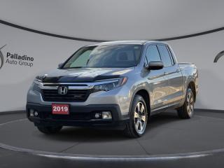 <b>Sunroof,  Heated Seats,  Remote Start,  Apple CarPlay,  Android Auto!</b><br> <br>    This amazing work truck offers a refined ride and excellent road manners regardless if its under load or not. This  2019 Honda Ridgeline is fresh on our lot in Sudbury. <br> <br>The 2019 Ridgeline presents itself as a high value pickup that offers the utility of a hauler while also being a well mannered vehicle with car like handling and acceleration. A quality built interior that is both supportive and comfortable is a big plus for such a pickup, as well as being a bulletproof reliable vehicle, which comes naturally with all Hondas. While it does look unconventional, the design is meant to blend the best of trucks and SUVs and gives the Ridgeline its unique niche in the mid size truck market.This  Crew Cab 4X4 pickup  has 95,936 kms. Its  silver in colour  . It has an automatic transmission and is powered by a  3.5L V6 24V GDI SOHC engine.  It may have some remaining factory warranty, please check with dealer for details. <br> <br> Our Ridgelines trim level is Sport. This Honda Ridgeline Sport is ready to prove itself with a one touch power moonroof, heated front seats, proximity keyless entry, remote start, 7 inch driver information centre, active noise cancellation, HomeLink remote, Apple CarPlay, Android Auto, Bluetooth, audio display, USB and aux inputs, and Wi-Fi tethering. Active safety features include collision mitigation with forward collision warning, lane keep assist, adaptive cruise control, and a blind spot monitor. Other features include multi-angle rearview camera, multifunction steering wheel, eco friendly technology, ECON mode, all wheel drive, aluminum wheels, trailer brake controller pre wiring, 7 pin wiring, heavy duty motor and trans cooling, trailer stability assist, dual action tailgate, fog lights, in bed trunk, LED taillights, side mirror turn signals, tri-zone automatic climate control, and rear underseat storage. This vehicle has been upgraded with the following features: Sunroof,  Heated Seats,  Remote Start,  Apple Carplay,  Android Auto,  Collision Mitigation,  Lane Keep Assist. <br> <br>To apply right now for financing use this link : <a href=https://www.palladinohonda.com/finance/finance-application target=_blank>https://www.palladinohonda.com/finance/finance-application</a><br><br> <br/><br>Palladino Honda is your ultimate resource for all things Honda, especially for drivers in and around Sturgeon Falls, Elliot Lake, Espanola, Alban, and Little Current. Our dealership boasts a vast selection of high-class, top-quality Honda models, as well as expert financing advice and impeccable automotive service. These factors arent what set us apart from other dealerships, though. Rather, our uncompromising customer service and professionalism make every experience unforgettable, and keeps drivers coming back. The advertised price is for financing purchases only. All cash purchases will be subject to an additional surcharge of $2,501.00. This advertised price also does not include taxes and licensing fees.<br> Come by and check out our fleet of 110+ used cars and trucks and 60+ new cars and trucks for sale in Sudbury.  o~o