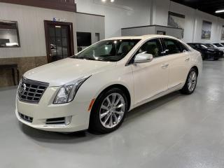 This 2013 CADILLAC XTS PREMIUM COLLECTION in pearl white is top of the line. GORGEUS GORGEUS GORGEUS. pictures dont do justice MUST SEE!!!!<br>In immaculate condition inside and out not even a scratch, like new. To many features to post, Navigation, camera, heated leather seats front and back,  AIR COOLED SEATS, panorama roof and much more. LOW KMS.<br><br>NO ACCIDENTS<br><br>Extended warranty available.<br>Accessories available at request. Accessories available at request. H.S.T. & licensing extra.<br>As per omvic regulations this vehicle is not certified and e-tested. Certification and 90 day powertrain warranty is available for $899.<br>FINANCING and LEASING options at preferred rates on O.A.C. on all vehicles.<br>Call us 905-760-1909<br>