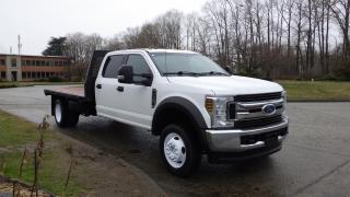 2019 Ford F-550 Crew Cab 4WD Dually, Flat Deck 6.8L V10 SOHC 30V engine, 10 cylinder, 4 door, automatic, 4WD, cruise control, air conditioning, deck mounted spare tire, differential locker, 4wd selector, manuall mode, aux, traction control, 6 auxiliary buttons, power seats, AM/FM radio, power door locks, power windows, power mirrors, white exterior, black interior, cloth. Measurements: 203 Wheelbase.(All the measurements are deemed to be true but are not guaranteed). Certificate and Decal Valid to February 2025 $48,710.00 plus $375 processing fee, $49,085.00 total payment obligation before taxes.  Listing report, warranty, contract commitment cancellation fee, financing available on approved credit (some limitations and exceptions may apply). All above specifications and information is considered to be accurate but is not guaranteed and no opinion or advice is given as to whether this item should be purchased. We do not allow test drives due to theft, fraud and acts of vandalism. Instead we provide the following benefits: Complimentary Warranty (with options to extend), Limited Money Back Satisfaction Guarantee on Fully Completed Contracts, Contract Commitment Cancellation, and an Open-Ended Sell-Back Option. Ask seller for details or call 604-522-REPO(7376) to confirm listing availability.