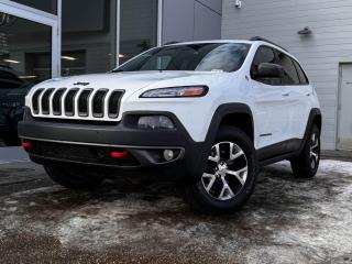Climb inside of our 2015 Cherokee Trailhawk in Bright White and feel at home! Its powered by a 3.2 Litre V6 engine that produces 184 horsepower while paired to a smooth shifting 9-Speed automatic transmission. The dazzling black alloy wheels, black badging, rear spoiler and roof rails heighten the sporty vibe of this 4WD 5 passenger SUV!Open the door to our Trailhawk and find a world of comfort and convenience. Settle into leather heated seats, grip the leather-wrapped heated steering wheel with mounted audio/cruise controls and look up to see a power panoramic sunroof. Look over to seethe 8.4-inch touchscreen display, navigation, AM/FM radio that is XM radio ready,dual-zone automatic temperature control, push-button ignition and stay connected with the Bluetooth hands-free phone system!Youll drive confidently knowing our Jeep has a wide variety of safety features that includes a back-up camera, Select-Terrain (auto, snow, sport, sand/mud), a back-up camera, a fleet of advanced airbags throughout the vehicle, anti-lock disc brakes, stability/traction control, and more!Print this page and call us Now... We Know You Will Enjoy Your Test Drive Towards Ownership! We look forward to showing you why Go Mazda is the best place for all your automotive needs.Go Mazda is an AMVIC licensed business.Please note: this vehicle was previously registered in the province of Quebec.
