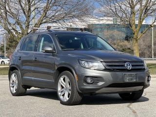 Gray 2012 Volkswagen Tiguan Trendline 4Motion 4Motion 4D Sport Utility 2.0L I4 TSI Turbocharged 6-Speed Automatic with Tiptronic AWD AWD, 3.45 Axle Ratio, 4-Wheel Disc Brakes, 8 Speakers, ABS brakes, Air Conditioning, Alloy wheels, AM/FM radio, AM/FM w/Single CD Player/MP3 Readable, Brake assist, Bumpers: body-colour, CD player, Cruise Control, Driver door bin, Driver vanity mirror, Dual front impact airbags, Dual front side impact airbags, Electronic Stability Control, Four wheel independent suspension, Front anti-roll bar, Front Bucket Seats, Front fog lights, Front reading lights, Heatable Front Seats, Heated door mirrors, Illuminated entry, Low tire pressure warning, Occupant sensing airbag, Outside temperature display, Overhead airbag, Overhead console, Pakata Cloth Seat Upholstery, Panic alarm, Passenger door bin, Passenger vanity mirror, Power door mirrors, Power steering, Power windows, Rear anti-roll bar, Rear reading lights, Rear window defroster, Rear window wiper, Remote keyless entry, Security system, Speed-sensing steering, Split folding rear seat, Spoiler, Tachometer, Telescoping steering wheel, Tilt steering wheel, Traction control, Trip computer, Turn signal indicator mirrors, Variably intermittent wipers.