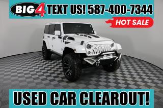 Every day is an adventure in our 2015 Jeep Wrangler Unlimited Sahara 4X4 shown in a Bright White Clearcoat paint scheme! Powered by a 3.6 Litre Pentastar V6 that offers 285hp combined with rock-solid Dana axles tethered to a commanding 6 Speed Manual transmission. With this Four Wheel Drive SUV, you can maintain civility or carve your path wherever you see fit, as you see approximately 11.2L/100km. Our Wrangler Unlimited goes beyond basic by offering a Freedom hardtop, fog lamps, power heated mirrors, and 18-inch polished aluminum wheels.

Sahara offers top-of-the-line features made with you in mind. Leahter-trimmed heated front seats keep you comfortable while enjoying the Uconnect 730N interface with a 20GB hard drive, hands-free communication with Bluetooth, a remote USB port, integrated voice command, and premium Alpine audio. Other modern features include cruise control, dual-zone climate control, power accessories, and a leather-wrapped steering wheel. If you get the urge to take an open-air cruise, remove the top and hit the road!

A strong safety cage surrounds you from Jeep, multistage airbags protect you, and Hill-start and stability control help you along the way. Our Wrangler Unlimited Sahara offers all of the legendary rock-climbing abilities of Americas favorite off-roader, with a dose of comfort to go along for the ride! Save this Page and Call for Availability. We Know You Will Enjoy Your Test Drive Towards Ownership!