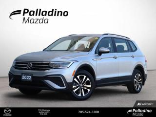 <b>Low Mileage, Heated Seats,  Heated Steering Wheel,  Lane Keep Assist,  Android Auto,  Apple CarPlay!<br> <br></b><br>     Everything from capacity, capability, comfort, and ease of use was designed with relentless purpose on this 2022 Tiguan. This  2022 Volkswagen Tiguan is fresh on our lot in Sudbury. <br> <br>Whether its a weekend warrior or the daily driver this time, this 2022 Tiguan makes every experience easier to manage. Cutting edge tech, both inside the cabin and under the hood, allow for safe, comfy, and connected rides that keep the whole party going. The crossover of the future is already here, and its called the Tiguan.This low mileage  SUV has just 10,404 kms. Its  pyrite silver metallic in colour  . It has an automatic transmission and is powered by a  2.0L I4 16V GDI DOHC Turbo engine. <br> <br> Our Tiguans trim level is Trendline. This spacious and comfortable Tiguan Trendline comes very well equipped with 4MOTION all-wheel drive capability, a 6.5 inch touchscreen display that features voice command, Android Auto and Apple CarPlay, heated front seats, a heated steering wheel, and blind spot detection. This sporty and stylish family SUVW also includes stylish aluminum wheels and black exterior accents, automatic LED lights, a 40/20/40 split-folding rear seats, an 8 inch digital cockpit, power heated mirrors and front assist with autonomous emergency braking plus much more! <br> This vehicle has been upgraded with the following features: Heated Seats,  Heated Steering Wheel,  Lane Keep Assist,  Android Auto,  Apple Carplay,  Blind Spot Detection,  Aluminum Wheels. <br> <br>To apply right now for financing use this link : <a href=https://www.palladinomazda.ca/finance/ target=_blank>https://www.palladinomazda.ca/finance/</a><br><br> <br/><br>Palladino Mazda in Sudbury Ontario is your ultimate resource for new Mazda vehicles and used Mazda vehicles. We not only offer our clients a large selection of top quality, affordable Mazda models, but we do so with uncompromising customer service and professionalism. We takes pride in representing one of Canadas premier automotive brands. Mazda models lead the way in terms of affordability, reliability, performance, and fuel efficiency.The advertised price is for financing purchases only. All cash purchases will be subject to an additional surcharge of $2,501.00. This advertised price also does not include taxes and licensing fees.<br> Come by and check out our fleet of 90+ used cars and trucks and 90+ new cars and trucks for sale in Sudbury.  o~o