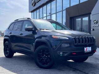 <b>Off-Road Suspension, Heated Seats, Aluminum Wheels, Rear View Camera, UConnect, Remote Keyless Entry<br> <br></b><br>   Compare at $20509 - Our Price is just $19912! <br> <br>   The 2018 Jeep Cherokee is an affordable mid-size SUV thats equal parts capable, stylish, and very comfortable. This  2018 Jeep Cherokee is for sale today in Midland. <br> <br>When the freedom to explore arrives alongside exceptional value, the world opens up to offer endless opportunities. This is what you can expect with this 2018 Jeep Cherokee. With an exceptionally smooth ride and an award-winning interior, the Cherokee can take you anywhere in comfort and style. Experience adventure and discover new territories with the unique and authentically crafted Jeep Cherokee, a major player in Canadas best-selling SUV brand. This  SUV has 158,569 kms. Its  rhino clearcoat in colour  . It has an automatic transmission and is powered by a  271HP 3.2L V6 Cylinder Engine.  <br> <br> Our Cherokees trim level is Trailhawk. Travel in style with this off-road-ready Cherokee Trailhawk. It comes loaded with 4-wheel drive capability, aluminum wheels and off-road suspension, skid plates, leather seats, Uconnect 3C with a 8.4 inch screen, a rearview camera, keyless entry and much more. This vehicle has been upgraded with the following features: Off-road Suspension,  Leather Seats,  Aluminum Wheels,  Rear View Camera,  Uconnect,  Remote Keyless Entry. <br> To view the original window sticker for this vehicle view this <a href=http://www.chrysler.com/hostd/windowsticker/getWindowStickerPdf.do?vin=1C4PJMBX9JD592702 target=_blank>http://www.chrysler.com/hostd/windowsticker/getWindowStickerPdf.do?vin=1C4PJMBX9JD592702</a>. <br/><br> <br>To apply right now for financing use this link : <a href=https://www.bourgeoishyundai.com/finance/ target=_blank>https://www.bourgeoishyundai.com/finance/</a><br><br> <br/><br>BUY WITH CONFIDENCE. Bourgeois Auto Group, we dont just sell cars; for over 75 years, we have delivered extraordinary automotive experiences in every showroom, on the road, and at your home. Offering complimentary delivery in an enclosed trailer. <br><br>Why buy from the Bourgeois Auto Group? Whether you are looking for a great place to buy your next new or used vehicle find a qualified repair center or looking for parts for your vehicle the Bourgeois Auto Group has the answer. We offer both new vehicles and pre-owned vehicles with over 25 brand manufacturers and over 200 Pre-owned Vehicles to choose from. Were constantly changing to meet the needs of our customers and stay ahead of the competition, and we are committed to investing in modern technology to ensure that we are always on the cutting edge. We use very strategic programs and tools that give us current market data to price our vehicles to the market to make sure that our customers are getting the best deal not only on the new car but on your trade-in as well. Ask for your free Live Market analysis report and save time and money. <br><br>WE BUY CARS  Any make model or condition, No purchase necessary. We are OPEN 24 hours a Day/7 Days a week with our online showroom and chat service. Our market value pricing provides the most competitive prices on all our pre-owned vehicles all the time. Market Value Pricing is achieved by polling over 20000 pre-owned websites every day to ensure that every single customer receives real-time Market Value Pricing on every pre-owned vehicle we sell. Customer service is our top priority. No hidden costs or fees, and full disclosure on all services and Carfax®. <br><br>With over 23 brands and over 400 full- and part-time employees, we look forward to serving all your automotive needs! <br> Come by and check out our fleet of 40+ used cars and trucks and 40+ new cars and trucks for sale in Midland.  o~o
