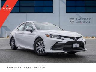 <p><strong><span style=font-family:Arial; font-size:18px;>Feel the unrivaled power and elegance in every drive with this masterful vehicle, the 2022 Toyota Camry LE..</span></strong></p> <p><strong><span style=font-family:Arial; font-size:18px;>This sleek sedan, presented in a pristine white exterior and luxurious black interior, is a testament to Toyotas commitment to quality, durability, and reliability..</span></strong> <br> With a locally driven history and an accident-free record, this beauty offers peace of mind alongside top-notch performance.. Powered by a robust 2.5L 4 cylinder engine, paired with an 8-speed automatic transmission, the Camry delivers a dynamic driving experience.</p> <p><strong><span style=font-family:Arial; font-size:18px;>Its impressive list of options includes ABS Brakes, Traction Control, and an Electronic Stability System, ensuring your safety on every journey..</span></strong> <br> Inside, youll find power windows and steering, air conditioning, and a plethora of convenience features like 1-touch down and up, a driver vanity mirror, front beverage holders, and more.. The heated door mirrors and auto high-beam headlights provide added visibility, while the exterior parking camera rear and traffic sign information system boost your confidence on the road.</p> <p><strong><span style=font-family:Arial; font-size:18px;>But did you know? This Camry also features a remarkable suite of advanced technology, including a steering wheel mounted with audio controls, a rear window defroster, and variably intermittent wipers..</span></strong> <br> The speed-sensing steering and brake assist give you enhanced control, while the front and rear anti-roll bars ensure a smooth ride.. This used model has traveled just 45,865 km, but it feels and performs like new, thanks to its four-wheel independent suspension and split folding rear seat that maximizes cargo space.</p> <p><strong><span style=font-family:Arial; font-size:18px;>Dont just love your carlove buying it..</span></strong> <br> Experience the exceptional value and unmatched quality of this Toyota Camry LE at Langley Chrysler.. Its not just a car; its a lifestyle choice.</p> <p><strong><span style=font-family:Arial; font-size:18px;>Make the smart choice and embrace the power, elegance, and advanced features of the 2022 Toyota Camry LE..</span></strong> <br> We invite you to witness its superior performance and timeless design at Langley Chrysler today.. Secure your dream ride now and stand out from the competition</p>Documentation Fee $968, Finance Placement $628, Safety & Convenience Warranty $699

<p>*All prices plus applicable taxes, applicable environmental recovery charges, documentation of $599 and full tank of fuel surcharge of $76 if a full tank is chosen. <br />Other protection items available that are not included in the above price:<br />Tire & Rim Protection and Key fob insurance starting from $599<br />Service contracts (extended warranties) for coverage up to 7 years and 200,000 kms starting from $599<br />Custom vehicle accessory packages, mudflaps and deflectors, tire and rim packages, lift kits, exhaust kits and tonneau covers, canopies and much more that can be added to your payment at time of purchase<br />Undercoating, rust modules, and full protection packages starting from $199<br />Financing Fee of $500 when applicable<br />Flexible life, disability and critical illness insurances to protect portions of or the entire length of vehicle loan</p>