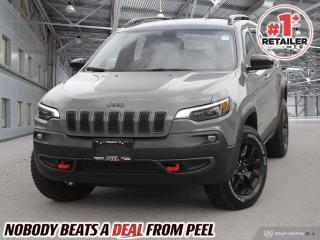 2022 Jeep Cherokee Trailhawk 4X4 | 3.2L Pentastar V6 | Sting Grey | Heated Bucket Seats | Heated Steering Wheel | Remote Start | Blind Spot Monitoring | Uconnect 4C 8.4" Touchscreen | Navigation | Apple CarPlay & Android Auto | Trailer Tow Group | Power Liftgate | Remote Proximity Keyless Entry

One Owner Clean Carfax

The 2022 Jeep Cherokee Trailhawk stands as the pinnacle of off-road capability and urban sophistication, blending rugged durability with refined comfort seamlessly. Powered by the robust 3.2L Pentastar V6 engine and clad in the striking Sting Grey paint, it commands attention both on and off the road. Its extensive suite of advanced safety features, including Jeep Active Drive Lock, Electronic Stability Control, Blind-Spot Monitoring, and Rear Cross-Path Detection, ensures peace of mind on every journey. Inside, the premium amenities abound, boasting a spacious and meticulously crafted cabin equipped with front heated seats, a heated steering wheel, and a power liftgate for added convenience. The Uconnect 4C NAV system with an 8.4-inch touchscreen offers seamless integration with Google Android Auto and Apple CarPlay, along with SiriusXM satellite radio and Guardian subscriptions, ensuring connectivity and entertainment on the go. Whether traversing rough terrain or cruising city streets, the Cherokee Trailhawk delivers unmatched versatility and capability, making it the ideal choice for adventure seekers and urban explorers alike. With the Trailer Tow Group and Uconnect 4C NAV package, along with the 17x7.5-inch Black aluminum wheels, this Cherokee Trailhawk is ready for any adventure, setting new standards in its class.
______________________________________________________

Engage & Explore with Peel Chrysler: Whether youre inquiring about our latest offers or seeking guidance, 1-866-652-6197 connects you directly. Dive deeper online or connect with our team to navigate your automotive journey seamlessly.

WE TAKE ALL TRADES & CREDIT. WE SHIP ANYWHERE IN CANADA! OUR TEAM IS READY TO SERVE YOU 7 DAYS! COME SEE WHY NOBODY BEATS A DEAL FROM PEEL! Your Source for ALL make and models used cars and trucks
______________________________________________________

*FREE CarFax (click the link above to check it out at no cost to you!)*

*FULLY CERTIFIED! (Have you seen some of these other dealers stating in their advertisements that certification is an additional fee? NOT HERE! Our certification is already included in our low sale prices to save you more!)

______________________________________________________

Peel Chrysler  A Trusted Destination: Based in Port Credit, Ontario, we proudly serve customers from all corners of Ontario and Canada including Toronto, Oakville, North York, Richmond Hill, Ajax, Hamilton, Niagara Falls, Brampton, Thornhill, Scarborough, Vaughan, London, Windsor, Cambridge, Kitchener, Waterloo, Brantford, Sarnia, Pickering, Huntsville, Milton, Woodbridge, Maple, Aurora, Newmarket, Orangeville, Georgetown, Stouffville, Markham, North Bay, Sudbury, Barrie, Sault Ste. Marie, Parry Sound, Bracebridge, Gravenhurst, Oshawa, Ajax, Kingston, Innisfil and surrounding areas. On our website www.peelchrysler.com, you will find a vast selection of new vehicles including the new and used Ram 1500, 2500 and 3500. Chrysler Grand Caravan, Chrysler Pacifica, Jeep Cherokee, Wrangler and more. All vehicles are priced to sell. We deliver throughout Canada. website or call us 1-866-652-6197. 

Your Journey, Our Commitment: Beyond the transaction, Peel Chrysler prioritizes your satisfaction. While many of our pre-owned vehicles come equipped with two keys, variations might occur based on trade-ins. Regardless, our commitment to quality and service remains steadfast. Experience unmatched convenience with our nationwide delivery options. All advertised prices are for cash sale only. Optional Finance and Lease terms are available. A Loan Processing Fee of $499 may apply to facilitate selected Finance or Lease options. If opting to trade an encumbered vehicle towards a purchase and require Peel Chrysler to facilitate a lien payout on your behalf, a Lien Payout Fee of $299 may apply. Contact us for details. Peel Chrysler Pre-Owned Vehicles come standard with only one key.