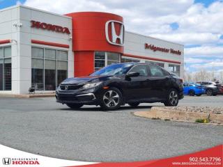 Recent Arrival! Nh731px 2019 Honda Civic DX FWD 6-Speed Manual 2.0L I4 DOHC 16V i-VTEC Bridgewater Honda, Located in Bridgewater Nova Scotia.6-Speed Manual, FWD, Black Cloth, 16 Steel Wheels w/Full Covers, 4-Wheel Disc Brakes, ABS brakes, AM/FM radio, Backup Camera, Brake assist, Bumpers: body-colour, Cruise Control, Delay-off headlights, Driver door bin, Driver vanity mirror, Dual front impact airbags, Dual front side impact airbags, Electronic Stability Control, Fabric Seating Surfaces, Forward collision: Collision Mitigation Braking System (CMBS) + FCW mitigation, Four wheel independent suspension, Front anti-roll bar, Front Bucket Seats, Front reading lights, Heated door mirrors, Illuminated entry, Lane departure: Lane Keeping Assist System (LKAS) active, Occupant sensing airbag, Outside temperature display, Overhead airbag, Panic alarm, Passenger door bin, Passenger vanity mirror, Power door mirrors, Power steering, Power windows, Radio: 160-Watt AM/FM Audio System, Rear anti-roll bar, Rear window defroster, Remote keyless entry, Security system, Speed-sensing steering, Steering wheel mounted audio controls, Tachometer, Telescoping steering wheel, Tilt steering wheel, Traction control.Reviews:* This generation of Civic attracted shoppers with Hondas reputation for safety and reliability, and many owners report that good looks, a thoughtful and handy interior, and plenty of feature content for the money helped seal the deal. Headlight performance is highly rated, as is a smooth and punchy performance from the turbocharged engine. Source: autoTRADER.ca