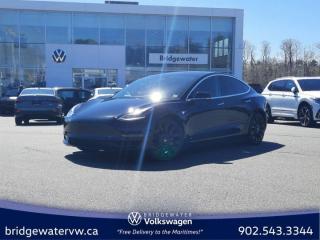 New Price! Solid Black 2020 Tesla Model 3 Performance AWD | Leather | Apple Carplay | Android Auto AWD 1-Speed Automatic Electric Motor Bridgewater Volkswagen, Located in Bridgewater Nova Scotia.15 Speakers, 4-Wheel Disc Brakes, ABS brakes, Air Conditioning, Alloy wheels, Auto High-beam Headlights, Auto-dimming Rear-View mirror, Automatic temperature control, Brake assist, Bumpers: body-colour, Compass, Delay-off headlights, Driver door bin, Driver vanity mirror, Dual front impact airbags, Dual front side impact airbags, Electronic Stability Control, Exterior Parking Camera Rear, Four wheel independent suspension, Front anti-roll bar, Front Bucket Seats, Front dual zone A/C, Front fog lights, Front reading lights, Fully automatic headlights, Genuine wood dashboard insert, Heated door mirrors, Heated front seats, Heated rear seats, Illuminated entry, Knee airbag, Low tire pressure warning, Memory seat, Navigation System, Occupant sensing airbag, Outside temperature display, Overhead airbag, Passenger door bin, Passenger vanity mirror, Power door mirrors, Power driver seat, Power passenger seat, Power steering, Power windows, Premium Audio System, Premium Heated Front Bucket Seats, Premium Seat Trim, Radio data system, Rear reading lights, Rear window defroster, Remote keyless entry, Security system, Speed control, Speed-sensing steering, Split folding rear seat, Spoiler, Steering wheel memory, Steering wheel mounted A/C controls, Steering wheel mounted audio controls, Telescoping steering wheel, Tilt steering wheel, Traction control, Trip computer, Variably intermittent wipers.Certification Program Details: 150 Points Inspection Fresh Oil Change Free Carfax Full Detail 2 years MVI Full Tank of Gas The 150+ point inspection includes: Engine Instrumentation Interior components Pre-test drive inspections The test drive Service bay inspection Appearance Final inspection