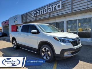 <b>Navigation,  Cooled Seats,  Leather Seats,  Sunroof,  Premium Audio System!</b><br> <br>  Compare at $42376 - Our Price is just $41498! <br> <br>   This 2019 Honda Ridgeline is packed to bursting with comfort, technology, and versatility for a modern mid size truck. This  2019 Honda Ridgeline is for sale today in Swift Current. <br> <br>The 2019 Ridgeline presents itself as a high value pickup that offers the utility of a hauler while also being a well mannered vehicle with car like handling and acceleration. A quality built interior that is both supportive and comfortable is a big plus for such a pickup, as well as being a bulletproof reliable vehicle, which comes naturally with all Hondas. While it does look unconventional, the design is meant to blend the best of trucks and SUVs and gives the Ridgeline its unique niche in the mid size truck market.This  Crew Cab 4X4 pickup  has 116,151 kms. Its  white in colour  . It has a 6 speed automatic transmission and is powered by a  280HP 3.5L V6 Cylinder Engine.  <br> <br> Our Ridgelines trim level is Touring. This awesome Ridgeline Touring comes equipped with navigation, cooled front seats, leather seats, one touch power moonroof, heated seats, proximity keyless entry, remote start, heated leather steering wheel, premium 540 W sound system, Apple CarPlay, Android Auto, Bluetooth, truck bed audio, memory driver seat and side mirrors, SiriusXM, automatic highbeams, blind spot information system, LED lighting, rain sensing wipers, 150W/400W truck bed power outlet, and ambient interior lighting. Active safety features include collision mitigation with forward collision warning, lane keep assist, and adaptive cruise control. Other features include multi-angle rearview camera, multifunction steering wheel, eco friendly technology, ECON mode, all wheel drive, aluminum wheels, dual action tailgate, fog lights, in bed trunk, LED taillights, and side mirror turn signals. This vehicle has been upgraded with the following features: Navigation,  Cooled Seats,  Leather Seats,  Sunroof,  Premium Audio System,  Memory Seats,  Active Safety. <br> <br>To apply right now for financing use this link : <a href=https://www.standardnissan.ca/finance/apply-for-financing/ target=_blank>https://www.standardnissan.ca/finance/apply-for-financing/</a><br><br> <br/><br>Why buy from Standard Nissan in Swift Current, SK? Our dealership is owned & operated by a local family that has been serving the automotive needs of local clients for over 110 years! We rely on a reputation of fair deals with good service and top products. With your support, we are able to give back to the community. <br><br>Every retail vehicle new or used purchased from us receives our 5-star package:<br><ul><li>*Platinum Tire & Rim Road Hazzard Coverage</li><li>**Platinum Security Theft Prevention & Insurance</li><li>***Key Fob & Remote Replacement</li><li>****$20 Oil Change Discount For As Long As You Own Your Car</li><li>*****Nitrogen Filled Tires</li></ul><br>Buyers from all over have also discovered our customer service and deals as we deliver all over the prairies & beyond!#BetterTogether<br> Come by and check out our fleet of 40+ used cars and trucks and 40+ new cars and trucks for sale in Swift Current.  o~o