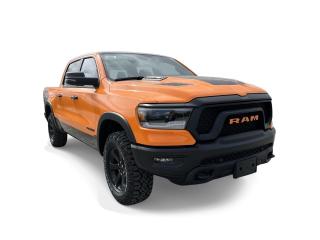 <p>The RAM 1500 Rebel Night boasts a commanding presence with its one of a kind orange wrapped exterior and luxurious Black leather interior. With its 5.7L HEMI V8 engine paired with FuelSaver MDS & eTorque, this truck delivers outstanding performance on and off the road.</p>

<p><strong>Performance</strong></p>

<p>With its 5.7L HEMI V8 engine paired with FuelSaver MDS & eTorque, this truck delivers outstanding performance on and off the road.</p>

<p><strong>Interior</strong></p>

<p>Step into sophistication with the Rebel Night's premium leather-faced front bucket seats and advanced features. From the 12-inch touchscreen infotainment system to the 19-speaker Harman/Kardon premium sound system and mesmerizing starlight roof including a dual-pane panoramic sunroof, every journey is elevated to new heights of comfort and convenience. Stay connected with Uconnect 5W NAV featuring a 12-inch display and enjoy seamless integration with Apple CarPlay and Android Auto.</p>

<p><strong>Exterior</strong></p>

<p>The RAM 1500 Rebel Night boasts a commanding presence with its unique and one of a kind orange wrapped exterior and sport performance hood.</p>

<p><strong>Safety</strong></p>

<p>Equipped with Full-Speed Forward Collision Warning Plus, ParkView Rear Back-Up Camera, and Park-Sense Front and Rear Park Assist with stop, the RAM 1500 Rebel Night ensures your peace of mind on every drive.</p>

<p>Discover the perfect blend of power, luxury, and capability with the 2023 RAM 1500 Rebel Night. Get behind the wheel and embark on your next adventure with confidence. Experience the difference at Barrie Chrysler today!</p>