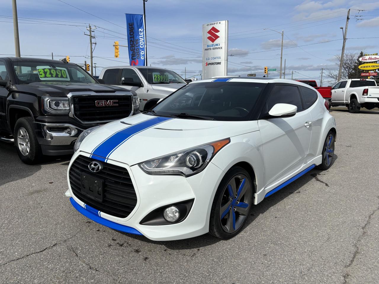 Introducing the sleek and stylish 2014 Hyundai Veloster 3dr Coupe Manual Turbo, the perfect combination of power and efficiency. This impressive vehicle boasts a turbocharged engine that delivers an exhilarating driving experience, while still providing great fuel economy. Equipped with a navigation system, Bluetooth connectivity, and a backup camera, this car makes every journey convenient and connected. Its unique three-door design adds a touch of personality, making it stand out from the crowd. With its advanced safety features and impressive handling, the Veloster offers a smooth and confident ride. Dont miss the chance to own this impressive car that offers both practicality and performance. Upgrade your driving experience and make a statement on the road with the 2014 Hyundai Veloster. 

G. D. Coates - The Original Used Car Superstore!
 
  Our Financing: We have financing for everyone regardless of your history. We have been helping people rebuild their credit since 1973 and can get you approvals other dealers cant. Our credit specialists will work closely with you to get you the approval and vehicle that is right for you. Come see for yourself why were known as The Home of The Credit Rebuilders!
 
  Our Warranty: G. D. Coates Used Car Superstore offers fully insured warranty plans catered to each customers individual needs. Terms are available from 3 months to 7 years and because our customers come from all over, the coverage is valid anywhere in North America.
 
  Parts & Service: We have a large eleven bay service department that services most makes and models. Our service department also includes a cleanup department for complete detailing and free shuttle service. We service what we sell! We sell and install all makes of new and used tires. Summer, winter, performance, all-season, all-terrain and more! Dress up your new car, truck, minivan or SUV before you take delivery! We carry accessories for all makes and models from hundreds of suppliers. Trailer hitches, tonneau covers, step bars, bug guards, vent visors, chrome trim, LED light kits, performance chips, leveling kits, and more! We also carry aftermarket aluminum rims for most makes and models.
 
  Our Story: Family owned and operated since 1973, we have earned a reputation for the best selection, the best reconditioned vehicles, the best financing options and the best customer service! We are a full service dealership with a massive inventory of used cars, trucks, minivans and SUVs. Chrysler, Dodge, Jeep, Ford, Lincoln, Chevrolet, GMC, Buick, Pontiac, Saturn, Cadillac, Honda, Toyota, Kia, Hyundai, Subaru, Suzuki, Volkswagen - Weve Got Em! Come see for yourself why G. D. Coates Used Car Superstore was voted Barries Best Used Car Dealership!