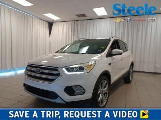 Our top-of-the-line 2017 Ford Escape Titanium 4WD is a knockout in White! Powered by a TurboCharged 2.0 Litre Twin-Scroll EcoBoost 4 Cylinder that offers 245hp paired to a responsive 6 Speed SelectShift Automatic transmission. Our Four Wheel Drive SUV handles beautifully with precise steering, awesome response, agility, and approximately 8.1L/100km on the road. This Escape turns heads and its prominent hexagonal upper grille, black roof rails, prominent 19-inch wheels, dual chrome exhaust tips, fog lamps, sculpted hood, a sunroof, and athletic stance. The Titanium interior greets you with a center console and plenty of cargo-carrying capacity to accommodate your next adventure. Youll appreciate amenities such as heated seats, heated steering wheel, remote engine start, Intelligent access with push-button start, a rear camera, 10-speaker Sony audio, available satellite radio, and SYNC Enhanced Voice Recognition Communication and Entertainment System. Carefully constructed with your active lifestyle in mind, Ford offers advanced airbags, stability control, SOS post-crash alert, tire pressure monitoring, and traction control to ensure your safety on the road. MyKey even lets you customize features such as speed and volume controls for the young drivers of the family. Delivering versatility, utility, efficiency, and style, our Escape Titanium is a terrific choice! Save this Page and Call for Availability. We Know You Will Enjoy Your Test Drive Towards Ownership! Steele Chevrolet Atlantic Canadas Premier Pre-Owned Super Center. Being a GM Certified Pre-Owned vehicle ensures this unit has been fully inspected fully detailed serviced up to date and brought up to Certified standards. Market value priced for immediate delivery and ready to roll so if this is your next new to your vehicle do not hesitate. Youve dealt with all the rest now get ready to deal with the BEST! Steele Chevrolet Buick GMC Cadillac (902) 434-4100 Metros Premier Credit Specialist Team Good/Bad/New Credit? Divorce? Self-Employed?