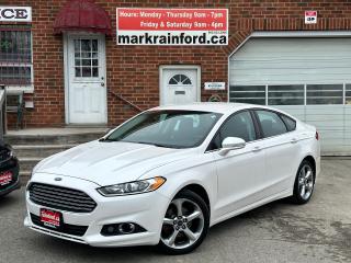 <p>Super-Clean, Local One-Owner Ford Fusion from Oshawa, ON! This SE model looks great in its white paint and has nice options inside and out! The exterior features keyless entry, keypad entry, remote electronic trunk release, automatic headlights, foglights, integrated mirror turn signals, heated mirrors, a very nice set of factory alloy wheels, a sleek rear spoiler, a peppy fuel-efficient 1.6L 4-cylinder turbocharged engine and automatic transmission! The interior is clean and comfortable with heated cloth power adjustable front seating with driver memory seating and lumbar control, a leather-wrapped steering wheel with audio and cruise controls, a spacious rear seat and cargo area, an easy-to-read-and-use gauge cluster, central AM/FM/XM Satellite Radio with Microsoft SYNC Bluetooth system, MP3 capabilities and CD Player, rear parking assist sensors, A/C climate control with front and rear window defrost settings, AUX/12V accessory ports and more!</p><p> </p><p>Carfax Claims Free, Good KM, One-Owner! </p><p> </p><p>Call (905) 623-2906</p><p> </p><p>Text Ryan: (905) 429-9680 or Email: ryan@markrainford.ca</p><p> </p><p>Text Mark: (905) 431-0966 or Email: mark@markrainford.ca</p>