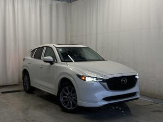 <p>NEW 2024 CX-5 GT AWD. Bluetooth, Skyactiv-G 2.5 L (Inline-4) Cylinder Deactivation. Backup Cam, NAV, Leather Heated/Ventilated Seats, Power Front Seats, Memory Driver Seat, Rear Heated Seats, Wireless Apple CarPlay/Android Auto, Wireless Phone Charger, Bose Premium Sound System, Advanced Keyless Remote Entry, Tilt/Sliding Moonroof, Power Trunk, Adaptive Cruise Control, Heated Steering Wheel, Wiper Blade De-Icer, Auto Dual-Zone Climate Control, Rear Air Vents, Auto Rain-Sensing Wipers, Electronic Parking Brake, Heated Mirrors, 19 Silver Metallic Alloy Wheels</p>  <p>Includes:</p> <p>i-ACTIVSENSE + Safety Features (Smart City Brake Support-Front, Rear Cross Traffic Alert, Mazda Radar Cruise Control With Stop & Go, Distance Recognition Support System, Lane-Keep Assist System, Lane Departure Warning System, Advanced Blind Spot Monitoring)</p>  <p>A joy to drive, our 2024 Mazda CX-5 GT AWD radiates refined style in Rhodium White Metallic! Motivated by a 2.5 Liter 4 Cylinder that delivers 187hp tethered to a paddle-shifted 6 Speed Automatic transmission. You can put that strength to good use with the added traction of torque vectoring, and this All Wheel Drive SUV returns nearly approximately 7.8L/100km on the highway. Our CX-5 also has an expressive design with bold details like 19-inch alloy wheels, a rear roof spoiler, and bright-tipped dual exhaust outlets.</p>  <p>Our GT cabin is no ordinary interior. Its tailor-made for better travel with heated leather power front seats, a leather-wrapped steering wheel, automatic climate control, pushbutton ignition, and keyless access. Mazda makes connecting easy by providing a 10.25-inch central display, a multifunction Commander controller, Apple CarPlay/Android Auto, Bluetooth, voice control, and six-speaker audio. The versatile rear cargo space adds adventure-friendly functionality.</p>  <p>Safety is a high priority for Mazda, which helps protect you and your loved ones with automatic emergency braking, adaptive cruise control, a rearview camera, lane-keeping assistance, blind-spot monitoring, and other intelligent technologies. With all that, our CX-5 GT is here to transcend the ordinary! Save this page, Come in for a Qualified Test Drive. We Know You Will Enjoy Your Test Drive Towards Ownership!</p>  <p>Call 587-409-5859 for more info or to schedule an appointment! Listed Pricing is valid for 72 hours. Financing is available, please see dealer for term availability and interest rates. AMVIC Licensed Business.</p>