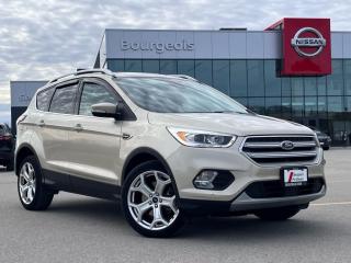 <b>Low Mileage, Moonroof, Heated Leather Seats, Power Lift Gate, USB, 2.0L Turbo, Remote Start.<br><br>Engine Options: It typically offers a 2.0-liter turbocharged four-cylinder engine that delivers strong performance.<br><br>Technology: Features like Fords</b><br>     With athletic looks and a quiet, stylish interior, this Ford Escape distinguishes itself in a crowd of small crossovers. This  2018 Ford Escape is for sale today in Midland. <br> <br>Although there are many compact SUVs to choose from, few have the styling, performance, and features offered by this 5-passenger Ford Escape. Beyond its strong, efficient drivetrain and handsome styling, this Escape offers nimble handling and a comfortable ride. The interior boasts smart design and impressive features. If you need the versatility of an SUV but want something fuel-efficient and easy to drive, this Ford Escape is just right. This low mileage  SUV has just 51,355 kms. Its  white gold metallic in colour  . It has a 6 speed automatic transmission and is powered by a  245HP 2.0L 4 Cylinder Engine.  It may have some remaining factory warranty, please check with dealer for details. <br> <br> Our Escapes trim level is Titanium. Upgrade to this Escape Titanium for extra luxury and style. It comes with blind spot assist, a reverse sensing system, a rearview camera, a SYNC 3 infotainment system with Bluetooth, SiriusXM, and Sony 10-speaker premium audio, leather seats which are heated in front, a foot-activated power liftgate, a heated steering wheel with audio and cruise control, aluminum wheels, and more. This vehicle has been upgraded with the following features: Leather Seats,  Rear View Camera,  Bluetooth,  Heated Seats,  Heated Steering Wheel,  Premium Sound Package,  Power Tailgate. <br> To view the original window sticker for this vehicle view this <a href=http://www.windowsticker.forddirect.com/windowsticker.pdf?vin=1FMCU9J96JUD52878 target=_blank>http://www.windowsticker.forddirect.com/windowsticker.pdf?vin=1FMCU9J96JUD52878</a>. <br/><br> <br>To apply right now for financing use this link : <a href=https://www.bourgeoisnissan.com/finance/ target=_blank>https://www.bourgeoisnissan.com/finance/</a><br><br> <br/><br>Since Bourgeois Midland Nissan opened its doors, we have been consistently striving to provide the BEST quality new and used vehicles to the Midland area. We have a passion for serving our community, and providing the best automotive services around.Customer service is our number one priority, and this commitment to quality extends to every department. That means that your experience with Bourgeois Midland Nissan will exceed your expectations whether youre meeting with our sales team to buy a new car or truck, or youre bringing your vehicle in for a repair or checkup.Building lasting relationships is what were all about. We want every customer to feel confident with his or her purchase, and to have a stress-free experience. Our friendly team will happily give you a test drive of any of our vehicles, or answer any questions you have with NO sales pressure.We look forward to welcoming you to our dealership located at 760 Prospect Blvd in Midland, and helping you meet all of your auto needs!<br> Come by and check out our fleet of 20+ used cars and trucks and 90+ new cars and trucks for sale in Midland.  o~o