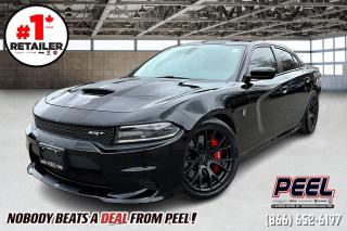 2016 Dodge Charger SRT Hellcat Sedan | 707 Horsepower | 6.2L Supercharged Hemi V8 | Full Laguna Leather seats | Heated & Ventilated Front Seats | Power Sunroof | Uconnect 8.4" Touchscreen w/ Navigation | Heated SRT Leather Wrapped Steering Wheel | 20x9.5 SRT Matte Black Lightweight Forged Wheels | Performance Hood | Red Brake Calipers | Remote Start | Heated Second Row Seats | Red Seatbelts | Parking Sensors | Bluetooth | 19 Speaker Harman/Kardon Audio System | Dual Catch Cans | Flowmaster Catback Exhaust w/ Anti Drone

Clean Carfax

Prepare to be electrified by the sheer power and iconic presence of the 2016 Dodge Charger SRT Hellcat. Renowned for its relentless performance and unmistakable style, the Charger SRT Hellcat stands as a true testament to American muscle. With its supercharged 6.2-liter HEMI V8 engine roaring under the hood, producing an astounding 707 horsepower, this beast is ready to unleash its fury on the asphalt. Yet, power is only part of the equation; the Charger SRT Hellcat exudes confidence and sophistication, boasting a sleek and aggressive exterior design that commands attention at every turn. Step inside the cockpit and immerse yourself in luxury, where premium materials and cutting-edge technology converge to create an unparalleled driving experience. With the addition of the Harman Kardon audio group, the Charger SRT Hellcat envelops you in concert-like sound quality, elevating your journey to new heights. Whether youre tearing up the track or cruising the streets, the 2016 Dodge Charger SRT Hellcat is more than just a car; its a legend in motion.
______________________________________________________

Engage & Explore with Peel Chrysler: Whether youre inquiring about our latest offers or seeking guidance, 1-866-652-6197 connects you directly. Dive deeper online or connect with our team to navigate your automotive journey seamlessly.

WE TAKE ALL TRADES & CREDIT. WE SHIP ANYWHERE IN CANADA! OUR TEAM IS READY TO SERVE YOU 7 DAYS! COME SEE WHY NOBODY BEATS A DEAL FROM PEEL! Your Source for ALL make and models used cars and trucks
______________________________________________________

*FREE CarFax (click the link above to check it out at no cost to you!)*

*FULLY CERTIFIED! (Have you seen some of these other dealers stating in their advertisements that certification is an additional fee? NOT HERE! Our certification is already included in our low sale prices to save you more!)

______________________________________________________

Peel Chrysler  A Trusted Destination: Based in Port Credit, Ontario, we proudly serve customers from all corners of Ontario and Canada including Toronto, Oakville, North York, Richmond Hill, Ajax, Hamilton, Niagara Falls, Brampton, Thornhill, Scarborough, Vaughan, London, Windsor, Cambridge, Kitchener, Waterloo, Brantford, Sarnia, Pickering, Huntsville, Milton, Woodbridge, Maple, Aurora, Newmarket, Orangeville, Georgetown, Stouffville, Markham, North Bay, Sudbury, Barrie, Sault Ste. Marie, Parry Sound, Bracebridge, Gravenhurst, Oshawa, Ajax, Kingston, Innisfil and surrounding areas. On our website www.peelchrysler.com, you will find a vast selection of new vehicles including the new and used Ram 1500, 2500 and 3500. Chrysler Grand Caravan, Chrysler Pacifica, Jeep Cherokee, Wrangler and more. All vehicles are priced to sell. We deliver throughout Canada. website or call us 1-866-652-6197. 

Your Journey, Our Commitment: Beyond the transaction, Peel Chrysler prioritizes your satisfaction. While many of our pre-owned vehicles come equipped with two keys, variations might occur based on trade-ins. Regardless, our commitment to quality and service remains steadfast. Experience unmatched convenience with our nationwide delivery options. All advertised prices are for cash sale only. Optional Finance and Lease terms are available. A Loan Processing Fee of $499 may apply to facilitate selected Finance or Lease options. If opting to trade an encumbered vehicle towards a purchase and require Peel Chrysler to facilitate a lien payout on your behalf, a Lien Payout Fee of $299 may apply. Contact us for details. Peel Chrysler Pre-Owned Vehicles come standard with only one key.