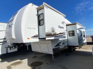 <p>Private Sale Save the GST!<br />29 5th wheel camper, 2010 Triple E Topaz, FS29RK XL, 2 slides, power awning, power vent in bathroom, side bath, rear kitchen, stand up dinette, leather lounging chairs, queen bed.  Includes Emerald Plus Onan 4000 Gen Set!  Under storage slide out drawer and more!</p>