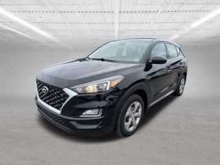 The 2019 Hyundai Tucson Essential Safety Package is a comprehensive set of safety features designed to enhance driver and passenger protection. This package typically includes several advanced safety technologies and conveniences aimed at preventing accidents and reducing the severity of impacts. Heres a detailed description of what the Essential Safety Package might offer:Forward Collision-Avoidance Assist (FCA):This system uses radar and cameras to monitor the road ahead. It can detect vehicles or pedestrians in your path and warn you of potential collisions. If necessary, it can automatically apply the brakes to prevent or mitigate a frontal collision.Lane Keeping Assist (LKA):LKA helps prevent unintentional lane departures by gently steering the vehicle back into its lane if it detects drifting without signaling. It uses cameras to monitor lane markings and keeps you centered in your lane.Driver Attention Warning (DAW):DAW monitors driving patterns for signs of driver fatigue or distraction. It can alert the driver with visual and audible warnings to take a break if it detects reduced attentiveness.High Beam Assist (HBA):HBA automatically toggles between high and low beams based on oncoming traffic, improving nighttime visibility without causing glare for other drivers.Electronic Stability Control (ESC):ESC helps maintain vehicle stability during sudden maneuvers or on slippery road conditions. It adjusts engine power and selectively applies braking to individual wheels to keep the vehicle on its intended path.Traction Control System (TCS):TCS prevents wheel spin during acceleration on low-traction surfaces like ice or gravel, enhancing control and stability.Anti-lock Braking System (ABS):ABS helps prevent wheels from locking up during hard braking, allowing the driver to maintain steering control and shorten stopping distances.Vehicle Stability Management (VSM):VSM integrates with ESC and other safety systems to assist in maintaining control during sudden braking or steering maneuvers.Hill-start Assist Control (HAC):HAC prevents the vehicle from rolling backward when starting on an incline by briefly maintaining brake pressure.Downhill Brake Control (DBC):DBC helps maintain control and stability when descending steep inclines by automatically applying the brakes to individual wheels.These features collectively offer peace of mind by actively assisting the driver in avoiding potential accidents and mitigating risks on the road. The Essential Safety Package is designed to make driving safer and more confident, particularly in challenging or unexpected driving conditions.