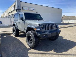 <p>Fully Inspected, ALL Work Complete and Included in Price! Lift Kit, Aftermarket Wheels, Call Us For More Info at 587-409-5859</p>  <p>Ready to tackle any terrain with style and precision, the 2020 Jeep Wrangler Sport 4x4 Manual is the epitome of adventure. With its iconic design and rugged capabilities, this vehicle exudes confidence on and off the road.</p>  <p>Equipped with a responsive manual transmission, the Wrangler Sport delivers an engaging driving experience, allowing you to fully immerse yourself in the thrill of the journey. Whether navigating city streets or exploring the great outdoors, its 4x4 capability ensures unparalleled traction and control, empowering you to conquer any obstacle with ease.</p>  <p>Inside, the Wrangler Sport offers a spacious and comfortable cabin, complete with modern amenities and intuitive technology to enhance your driving pleasure. From its versatile cargo space to its innovative infotainment system, every aspect of the interior is designed to cater to your needs and preferences.</p>  <p>Whether youre embarking on a weekend getaway or simply navigating daily life, the 2020 Jeep Wrangler Sport 4x4 Manual is your ultimate companion for adventure and exploration. Get ready to unleash your spirit of adventure and experience the freedom of the open road like never before.</p>  <p>Call 587-409-5859 for more info or to schedule an appointment! Listed Pricing is valid for 72 hours. Financing is available, please see dealer for term availability and interest rates. AMVIC Licensed Business.</p>